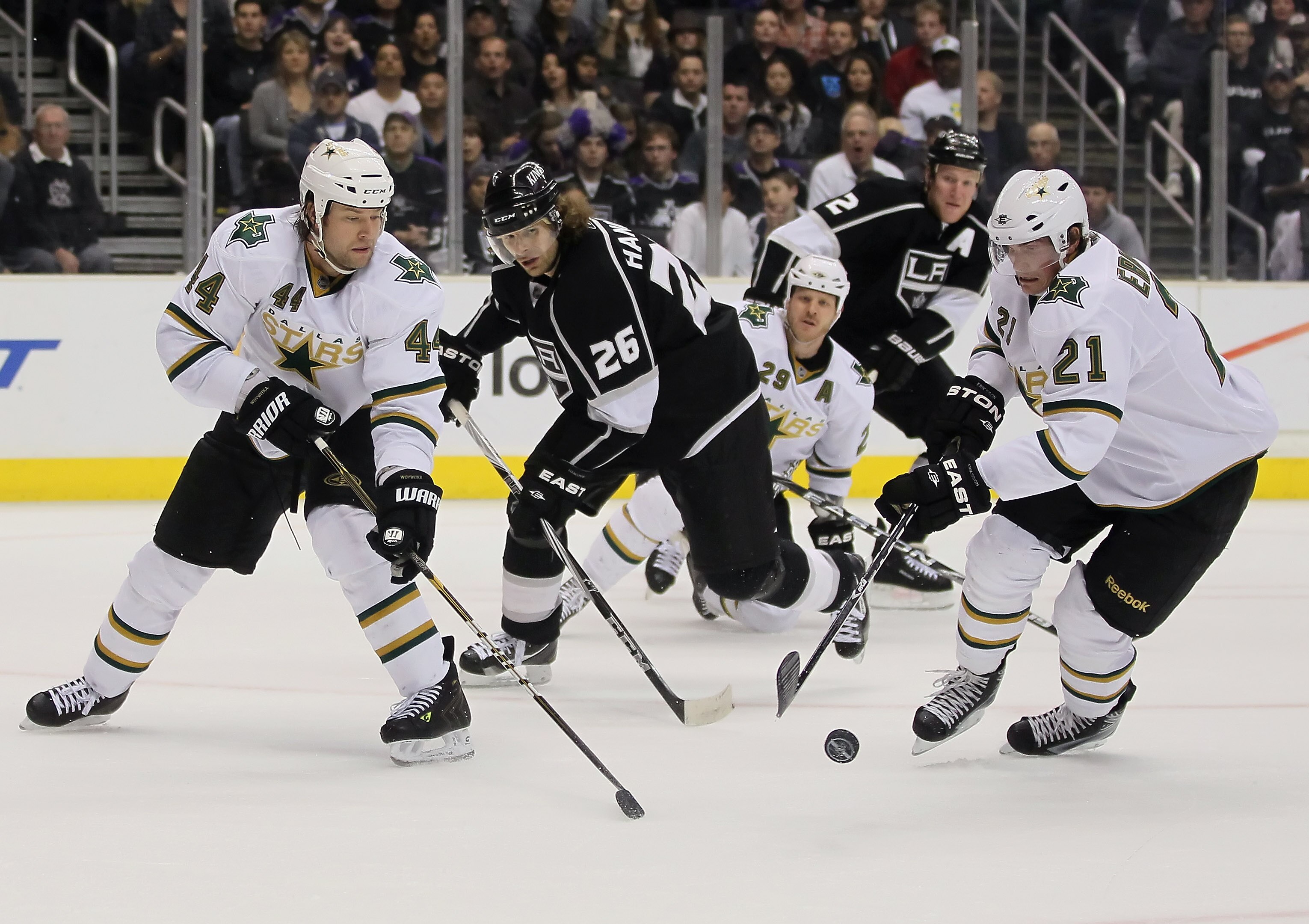 LOS ANGELES, CA - APRIL 02:  (L-R) Jeff Woywitka #44 of the Dallas Stars, Michal Handzus #26 of the Los Angeles Kings and Loui Eriksson #21 of the Stars battle for the puck in the second period at Staples Center on April 2, 2011 in Los Angeles, California