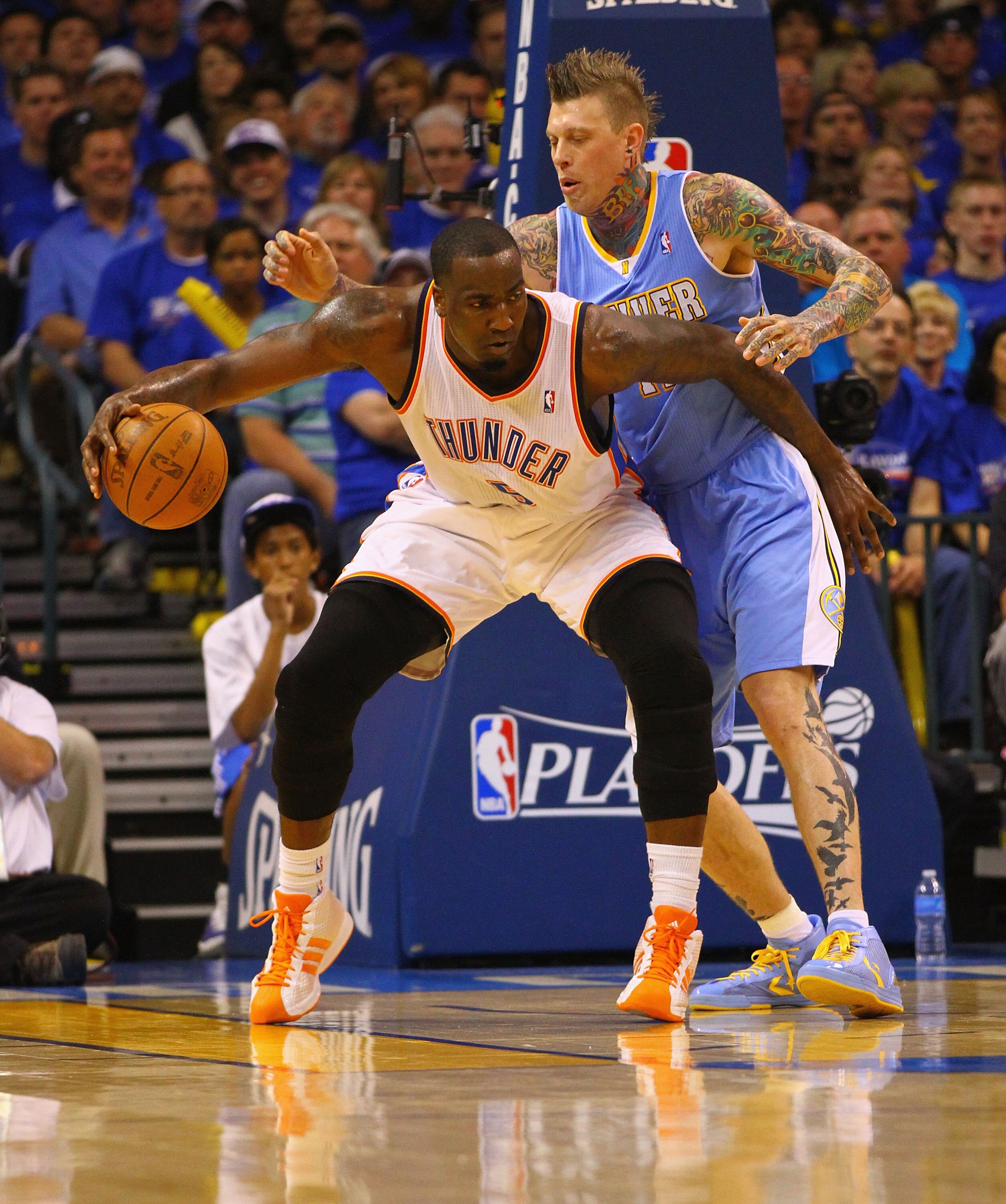 OKLAHOMA CITY, OK - APRIL 17: Kendrick Perkins #5 of the Oklahoma City Thunder looks to shoot the ball against Chris Andersen #11 of the Denver Nuggets in Game One of the Western Conference Quarterfinals in the 2011 NBA Playoffs on April 17, 2011 at the F