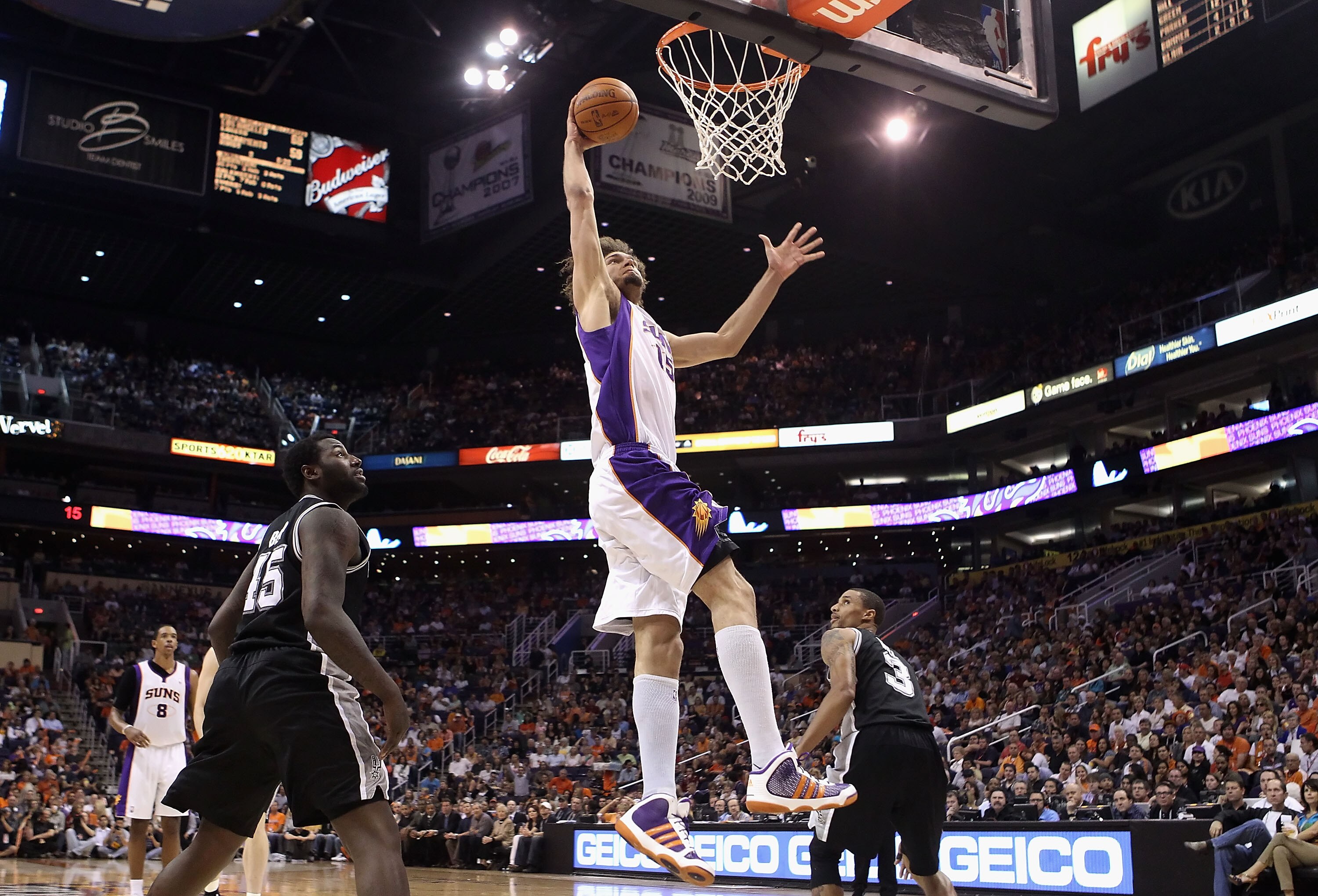 PHOENIX, AZ - APRIL 13:  Robin Lopez #15 of the Phoenix Suns slam dunks the ball against the San Antonio Spurs during the NBA game at US Airways Center on April 13, 2011 in Phoenix, Arizona.  NOTE TO USER: User expressly acknowledges and agrees that, by d
