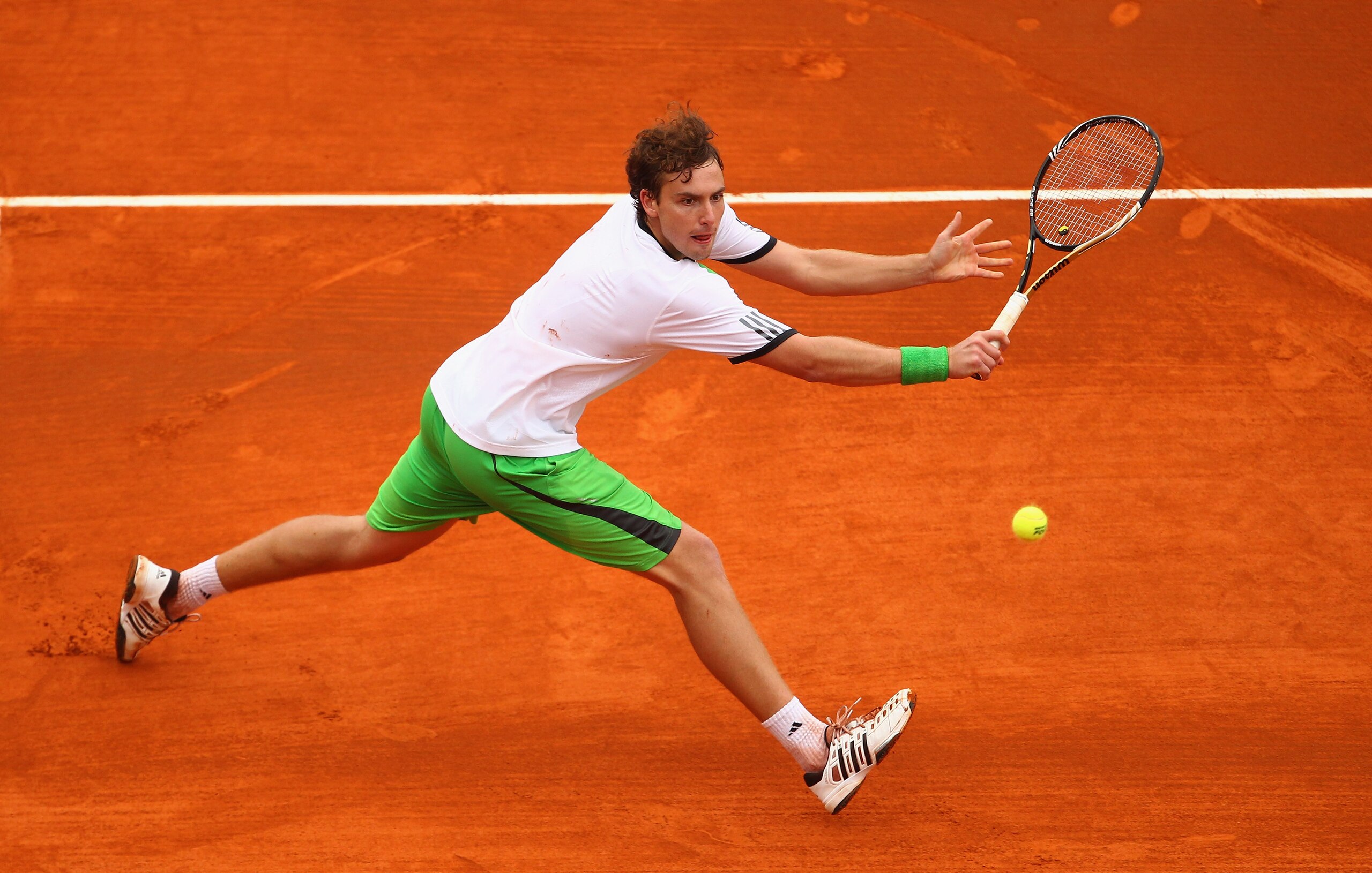 MONACO - APRIL 12:  Ernests Gulbis of Latvia plays a forehand in his match against Milos Raonic of Canada during Day Three of the ATP Masters Series Tennis at the Monte Carlo Country Club on April 12, 2011 in Monte Carlo, Monaco.  (Photo by Julian Finney/