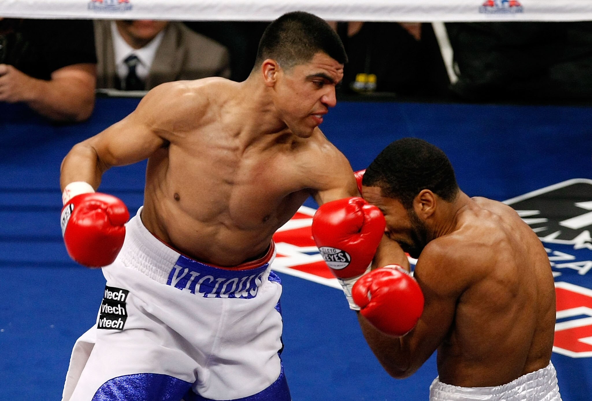 LAS VEGAS - DECEMBER 11:  (L-R) The elbow of Victor Ortiz connects to the face of Lamont Petersen during the super lightweight fight at Mandalay Bay Events Center on December 11, 2010 in Las Vegas, Nevada.  (Photo by Ethan Miller/Getty Images)