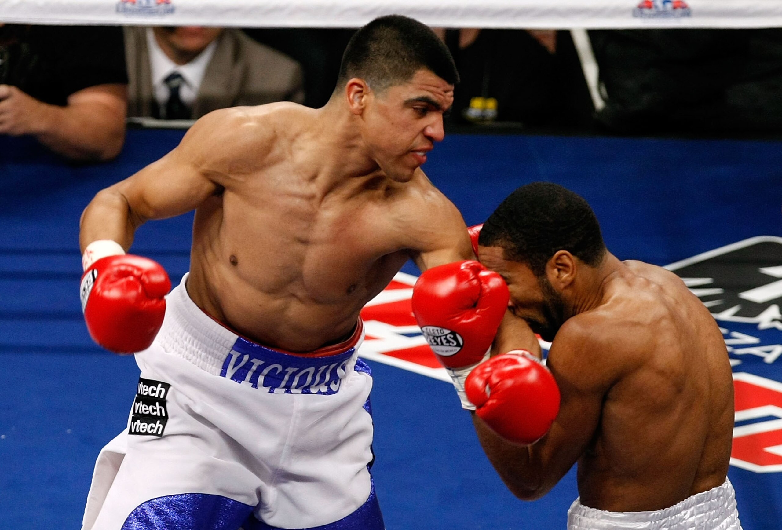 LAS VEGAS - DECEMBER 11:  (L-R) The elbow of Victor Ortiz connects to the face of Lamont Petersen during the super lightweight fight at Mandalay Bay Events Center on December 11, 2010 in Las Vegas, Nevada.  (Photo by Ethan Miller/Getty Images)