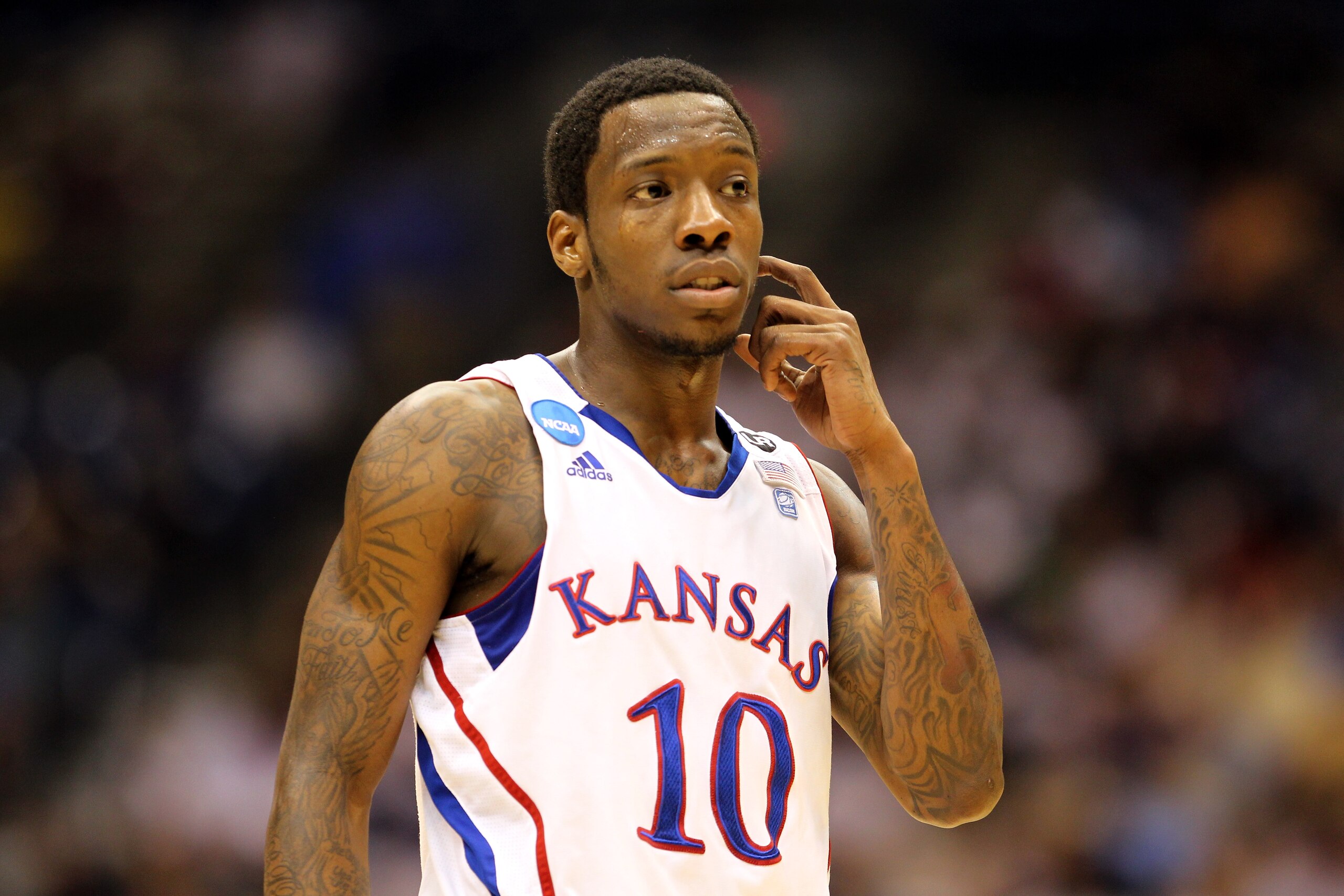 SAN ANTONIO, TX - MARCH 27:  Tyshawn Taylor #10 of the Kansas Jayhawks looks on during the southwest regional final of the 2011 NCAA men's basketball tournament against the Virginia Commonwealth Rams at the Alamodome on March 27, 2011 in San Antonio, Texa