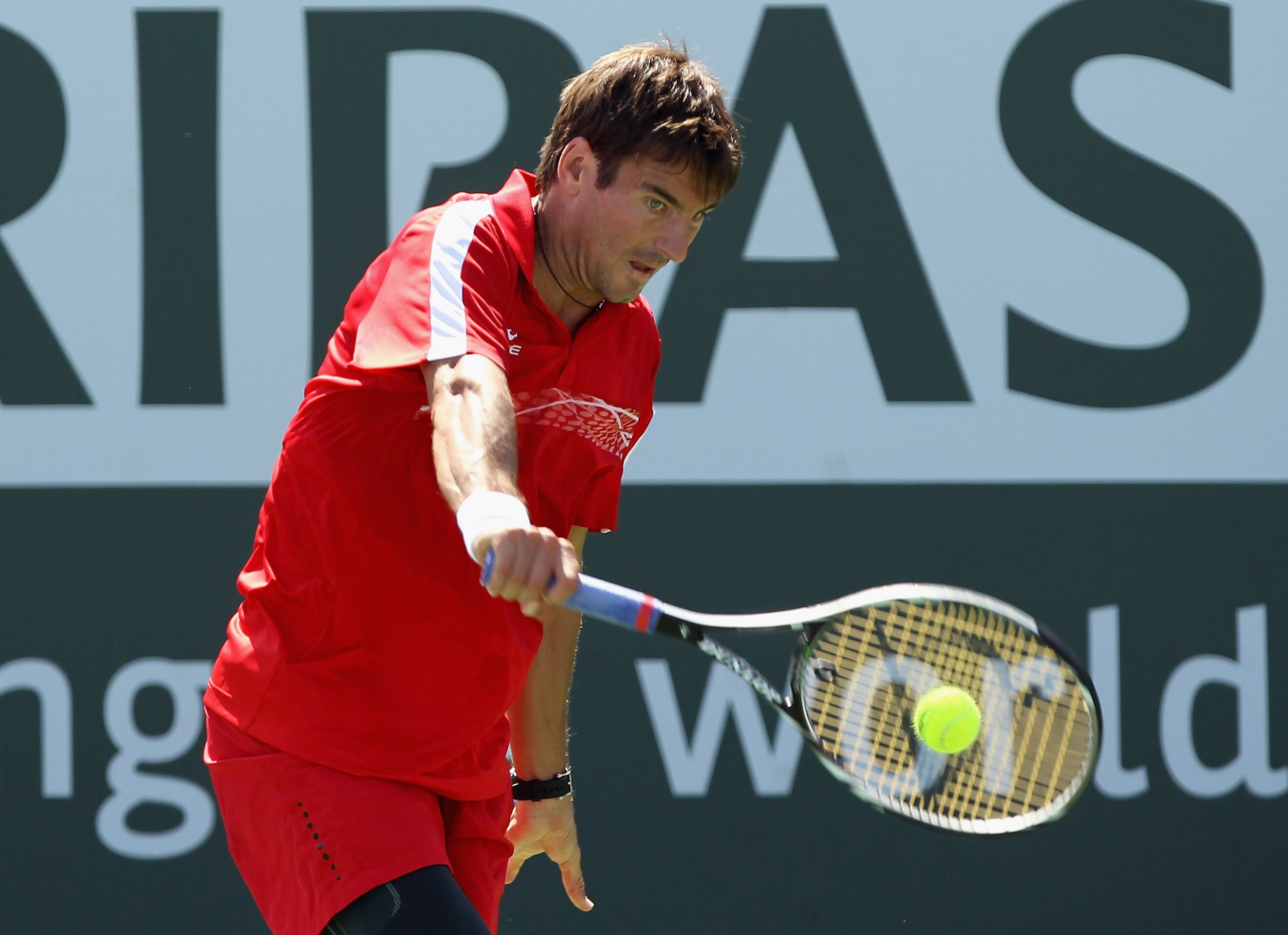 INDIAN WELLS, CA - MARCH 14:  Tommy Robredo of Spain returns a shot to Donald Young of the USA during the BNP Paribas Open at the Indian Wells Tennis Garden on March 14, 2011 in Indian Wells, California.  (Photo by Ezra Shaw/Getty Images)
