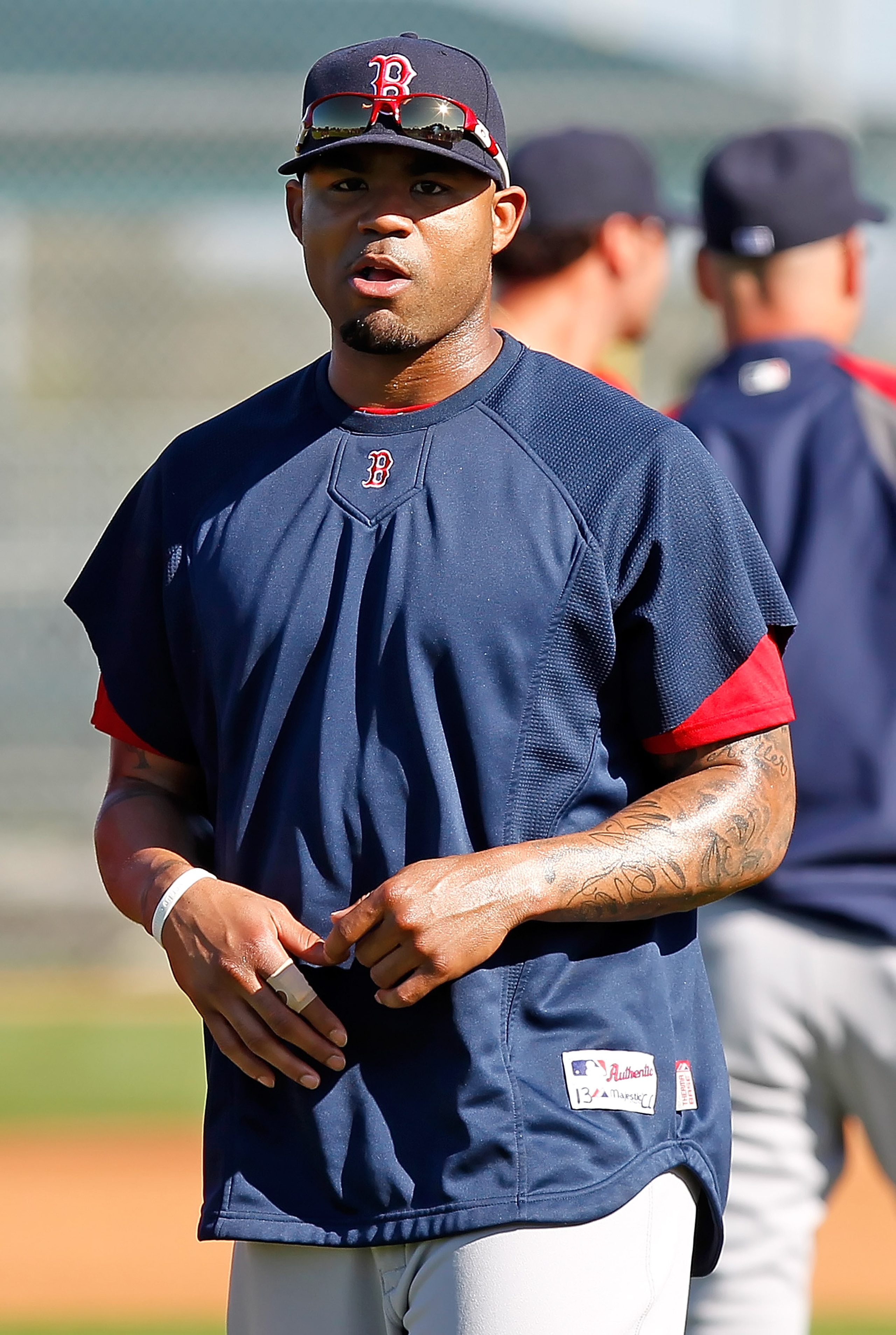 FORT MYERS, FL - FEBRUARY 19:  Outfielder Carl Crawford #13 of the Boston Red Sox warms up during a Spring Training Workout Session at the Red Sox Player Development Complex on February 19, 2011 in Fort Myers, Florida.  (Photo by J. Meric/Getty Images)