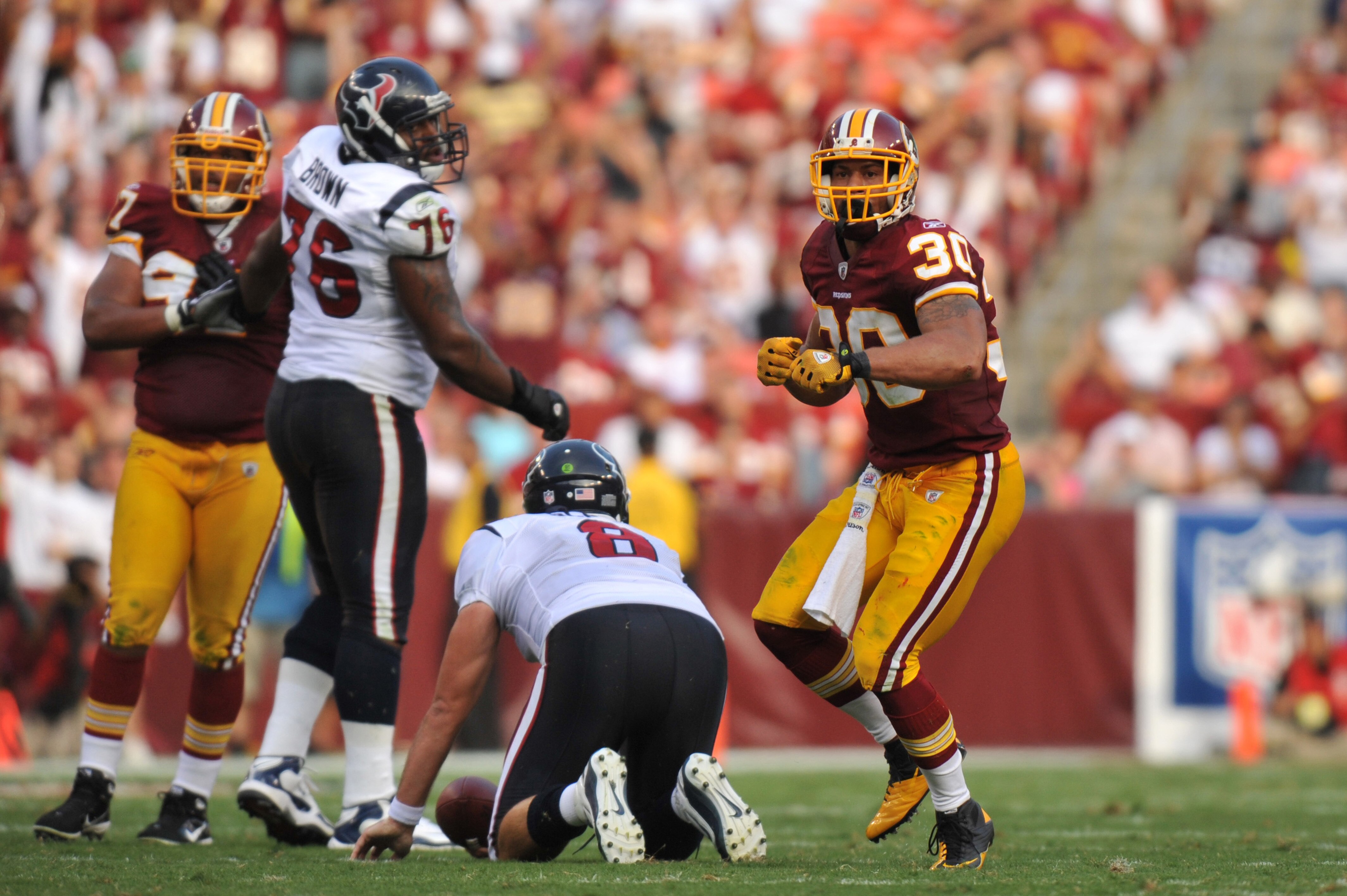 LANDOVER - SEPTEMBER 19:  LaRon Landry #30 of the Washington Redskins celebrates a sack of Matt Schaub #8 of the Houston Texans at FedExField on September 19, 2010 in Landover, Maryland. The Texans defeated the Redskins in overtime 30-27. (Photo by Larry