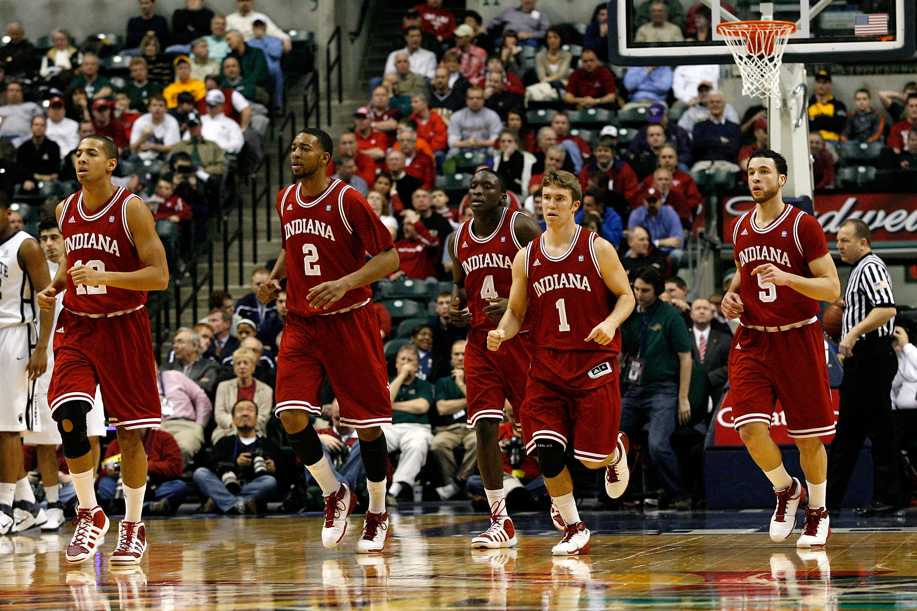 INDIANAPOLIS, IN - MARCH 10:  (L-R) Verdell Jones III #12, Christian Watford #2, Victor Oladipo #4, Jordan Hulls #1 and Jeremiah Rivers #5 of the Indiana Hoosiers run towards the bench for a timeout against the Penn State Nittany Lions during the first ro