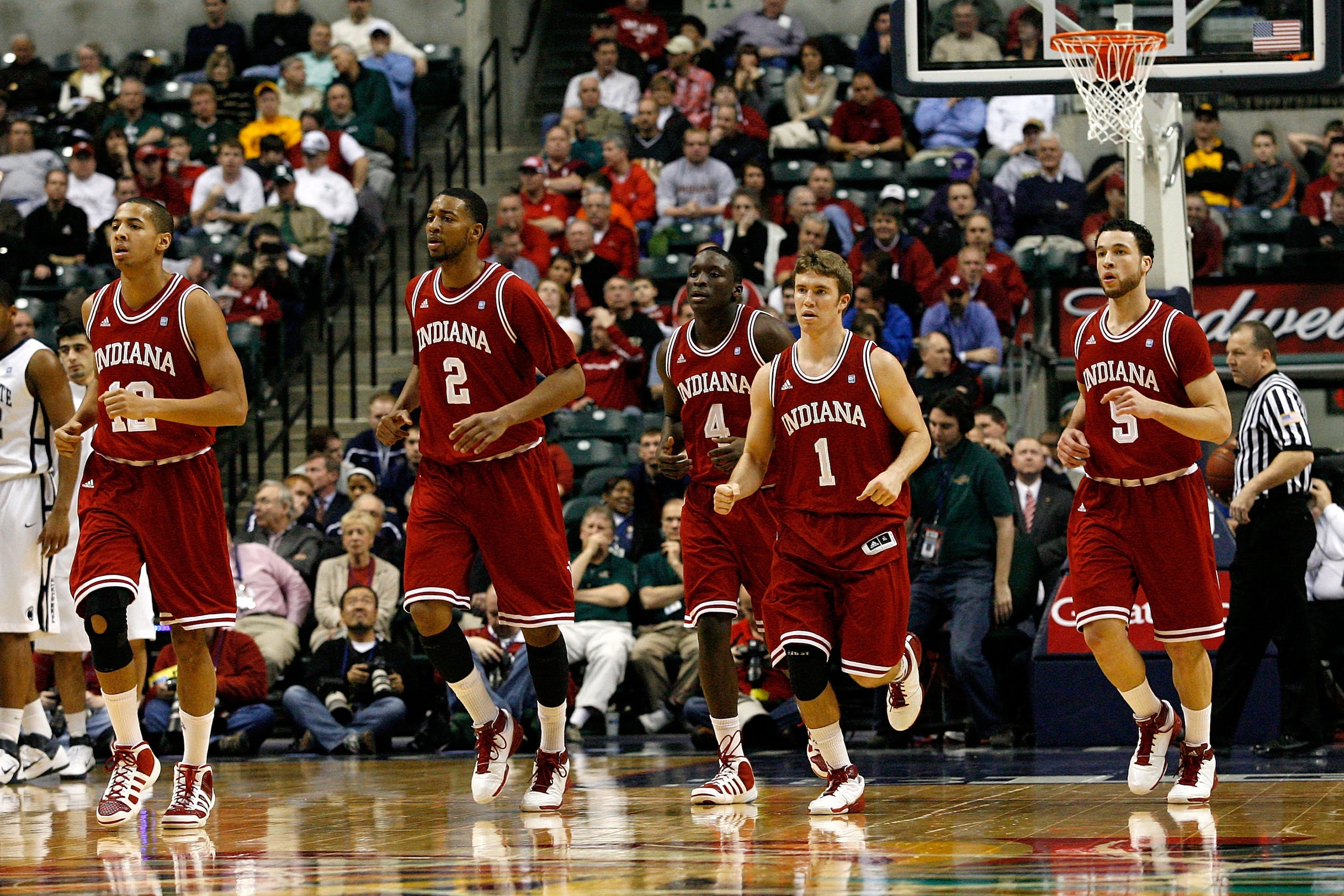 INDIANAPOLIS, IN - MARCH 10:  (L-R) Verdell Jones III #12, Christian Watford #2, Victor Oladipo #4, Jordan Hulls #1 and Jeremiah Rivers #5 of the Indiana Hoosiers run towards the bench for a timeout against the Penn State Nittany Lions during the first ro