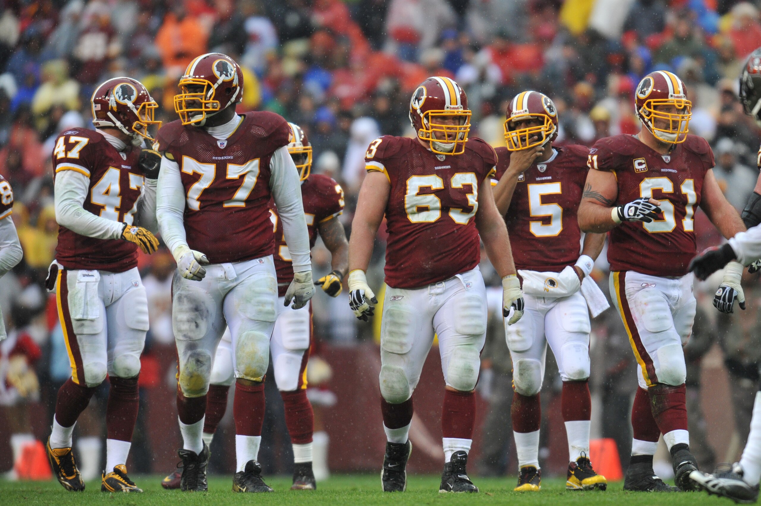 LANDOVER, MD - DECEMBER 12:  Casey Rabach #61 of the Washington Redskins walks up to the line of scrimmage with the offensive line during the game against the Tampa Bay Buccaneers  at FedExField on December 12, 2010 in Landover, Maryland. The Buccaneers d