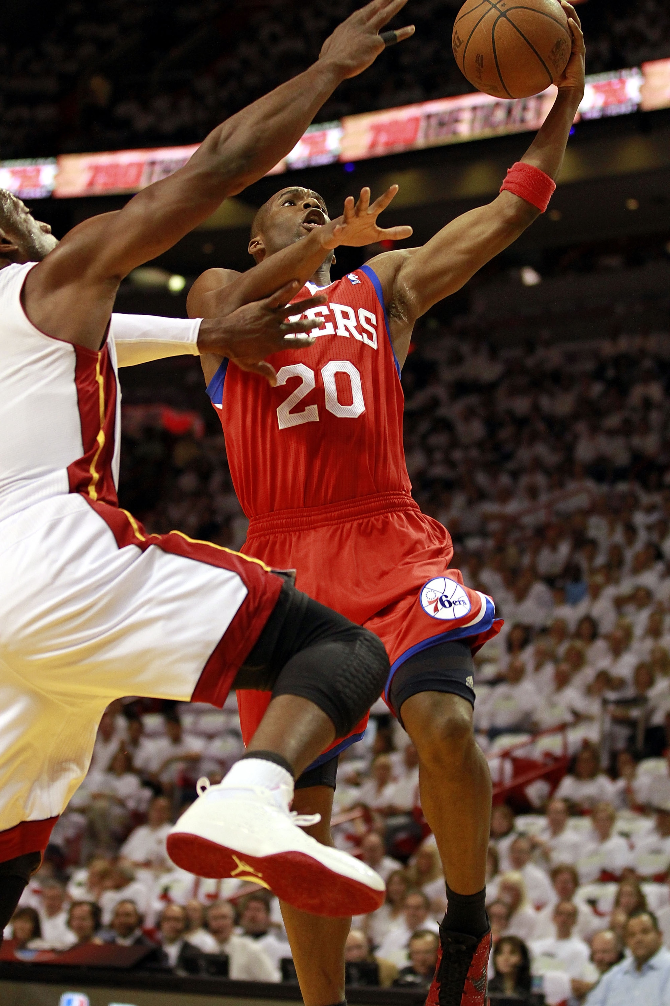 MIAMI, FL - APRIL 16: Guard Jodie Meeks #20 of the Philadelphia 76ers drives against Dwyane Wade #3 of the Miami Heat at the American Airlines Arena in Game One of the Eastern Conference Quarterfinals in the 2011 NBA Playoffs on April 16, 2011 in Miami, F