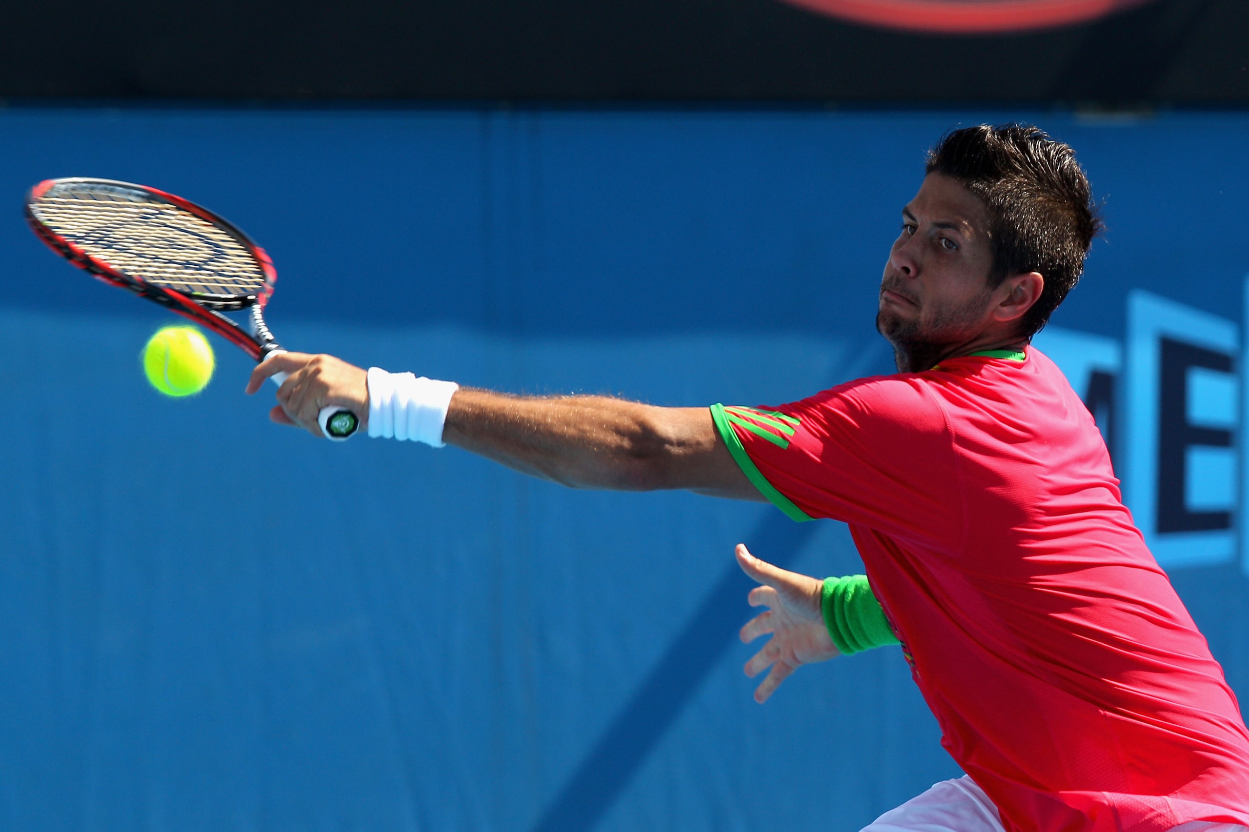 MELBOURNE, AUSTRALIA - JANUARY 23:  Fernando Verdasco of Spain plays a backhand in his fourth round match against Tomas Berdych of the Czech Republic during day seven of the 2011 Australian Open at Melbourne Park on January 23, 2011 in Melbourne, Australi