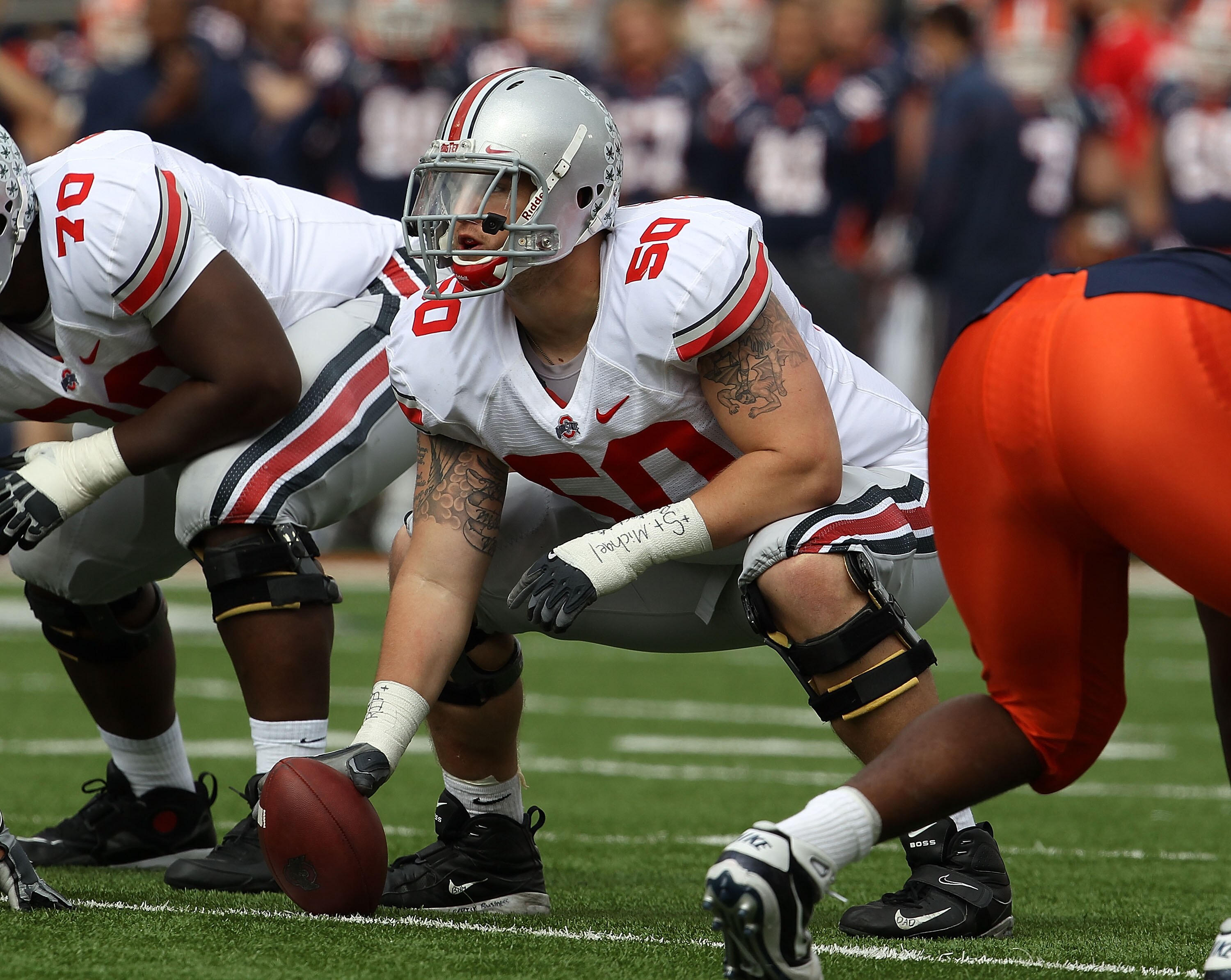 CHAMPAIGN, IL - OCTOBER 02: Mike Brewster #50 of the Ohio State Buckeyes waits to snap the ball against the Illinois Fighting Illini at Memorial Stadium on October 2, 2010 in Champaign, Illinois. Ohio State defeated Illinois 24-13.  (Photo by Jonathan Dan