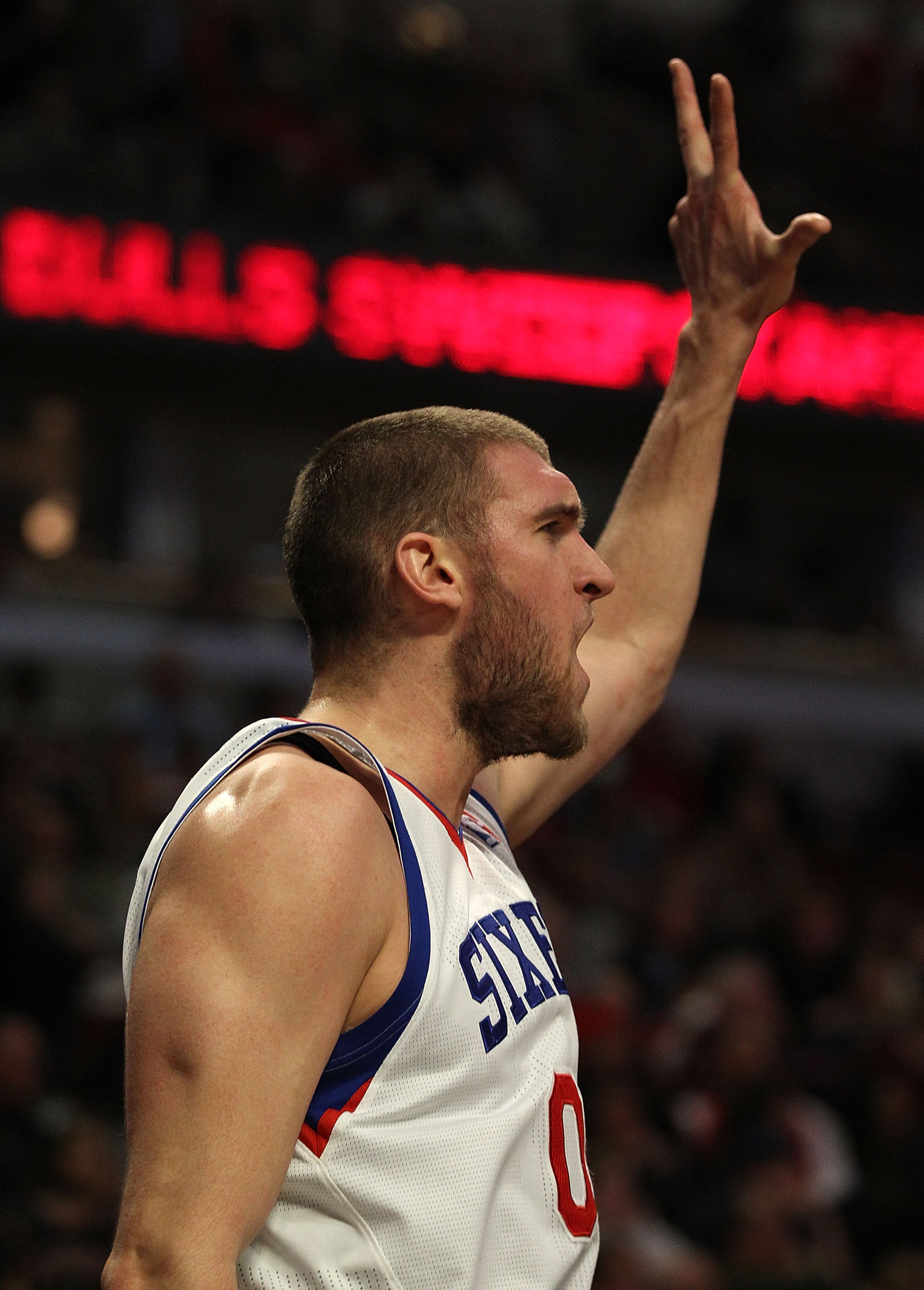CHICAGO, IL - MARCH 28: Spencer Hawes #00 of the Philadelphia 76ers celebrates a win over the Chicago Bulls at the United Center on March 28, 2011 in Chicago, Illinois. The 76ers defeated the Bulls 97-85. NOTE TO USER: User expressly acknowledges and agre CHICAGO, IL - MARCH 28: Spencer Hawes #00 of the Philadelphia 76ers celebrates a win over the Chicago Bulls at the United Center on March 28, 2011 in Chicago, Illinois. The 76ers defeated the Bulls 97-85. NOTE TO USER: User expressly acknowledges and agre