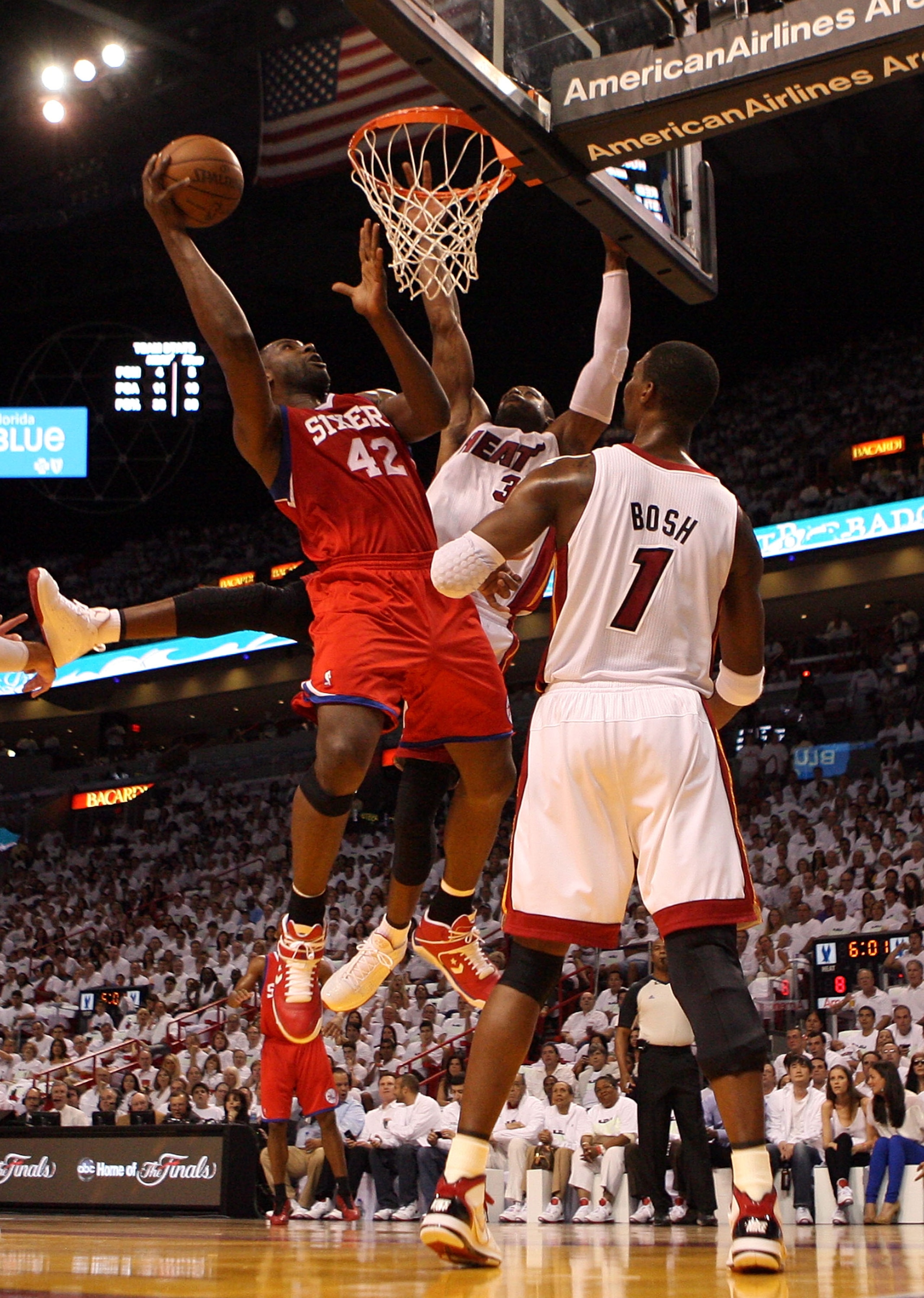 MIAMI, FL - APRIL 16:  Guard Dwyane Wade #3 and Center Chris Bosh #1 of the Miami Heat plays defend  against Elton Brand #42 of the Philadelphia 76ers at the American Airlines Arena in Game One of the Eastern Conference Quarterfinals in the 2011 NBA Playo