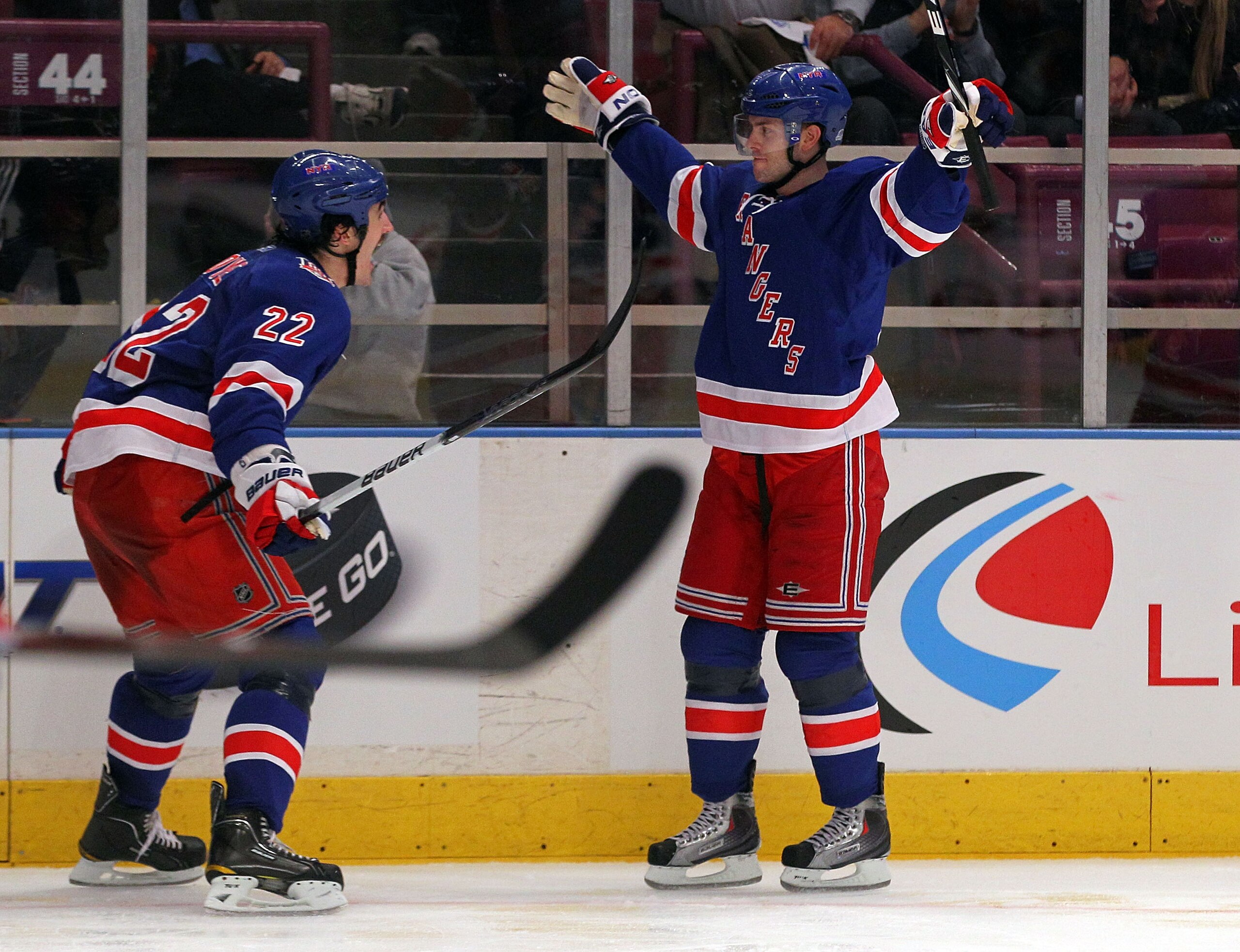 NEW YORK, NY - APRIL 17:  (L-R) Brian Boyle #22 and Erik Christensen #26 of the New York Rangers celebrate after Christensen scored a second period goal against the Washington Capitals in Game Three of the Eastern Conference Quarterfinals during the 2011