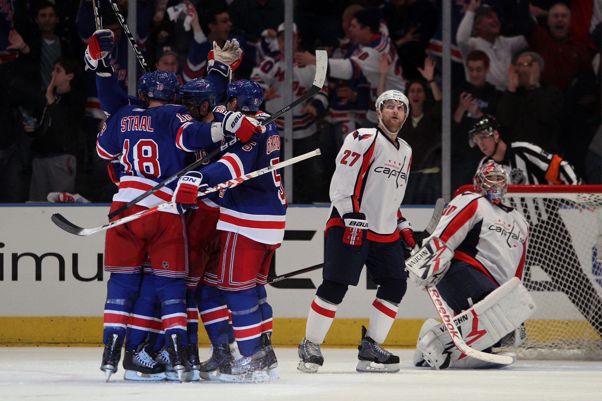 NEW YORK, NY - APRIL 17:  The New York Rangers celebrate after Vaclav Prospal #20 of the New York Rangers scored a second period goal in the third period against goalie Michal Neuvirth #30 and Karl Alzner #27 of the Washington Capitals in Game Three of th