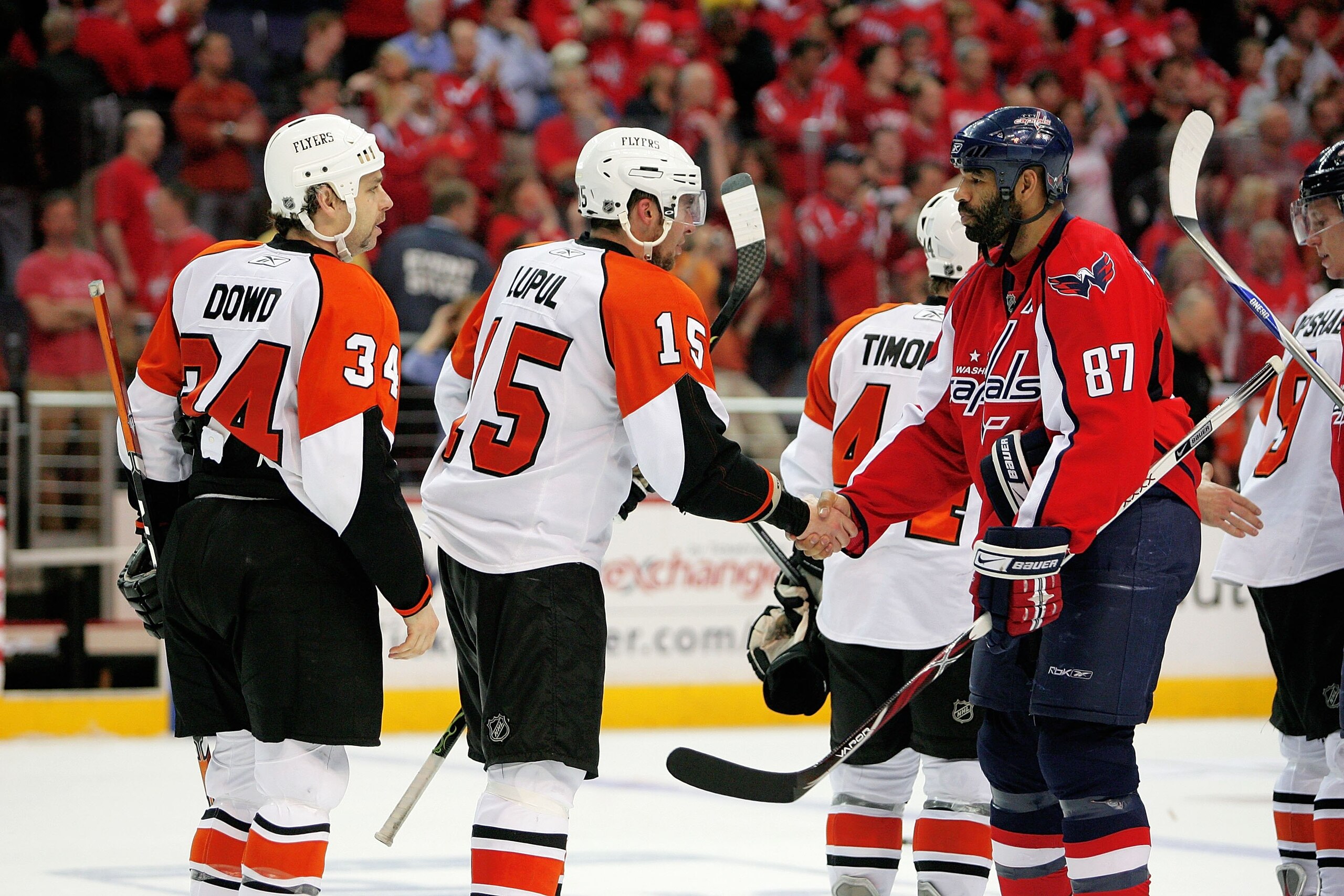 WASHINGTON - APRIL 22:  Donald Brashear #87 of the Washington Capitals shakes the hand of Joffrey Lupul #15 of the Philadelphia Flyers after a series clinching win during game seven of the Eastern Conference Quarterfinals of the 2008 NHL Stanley Cup Playo