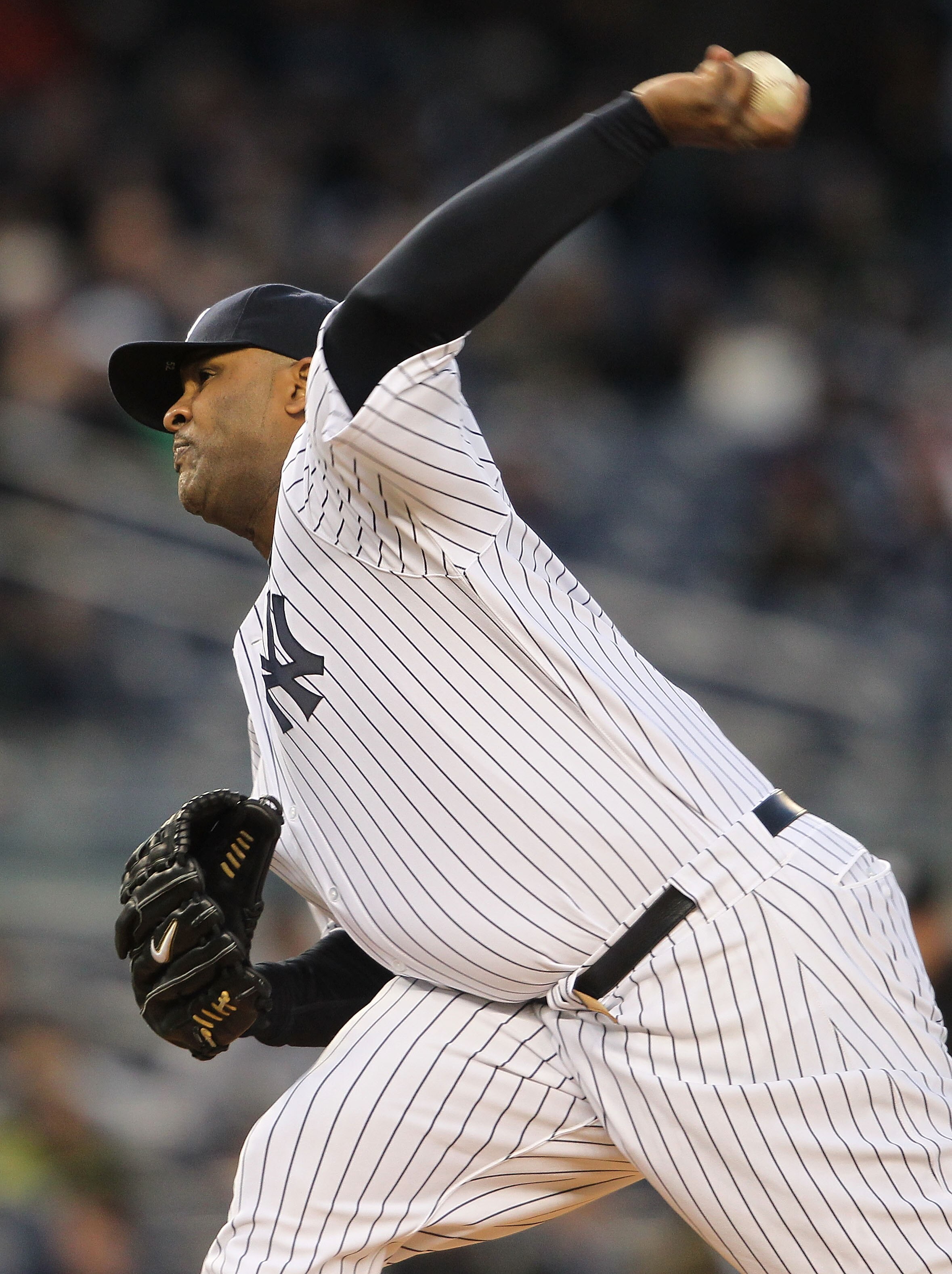 NEW YORK, NY - APRIL 05:  CC Sabathia #52 of the New York Yankees pitches against the Minnesota Twins at Yankee Stadium on April 5, 2011 in the Bronx borough of New York City.  (Photo by Nick Laham/Getty Images)