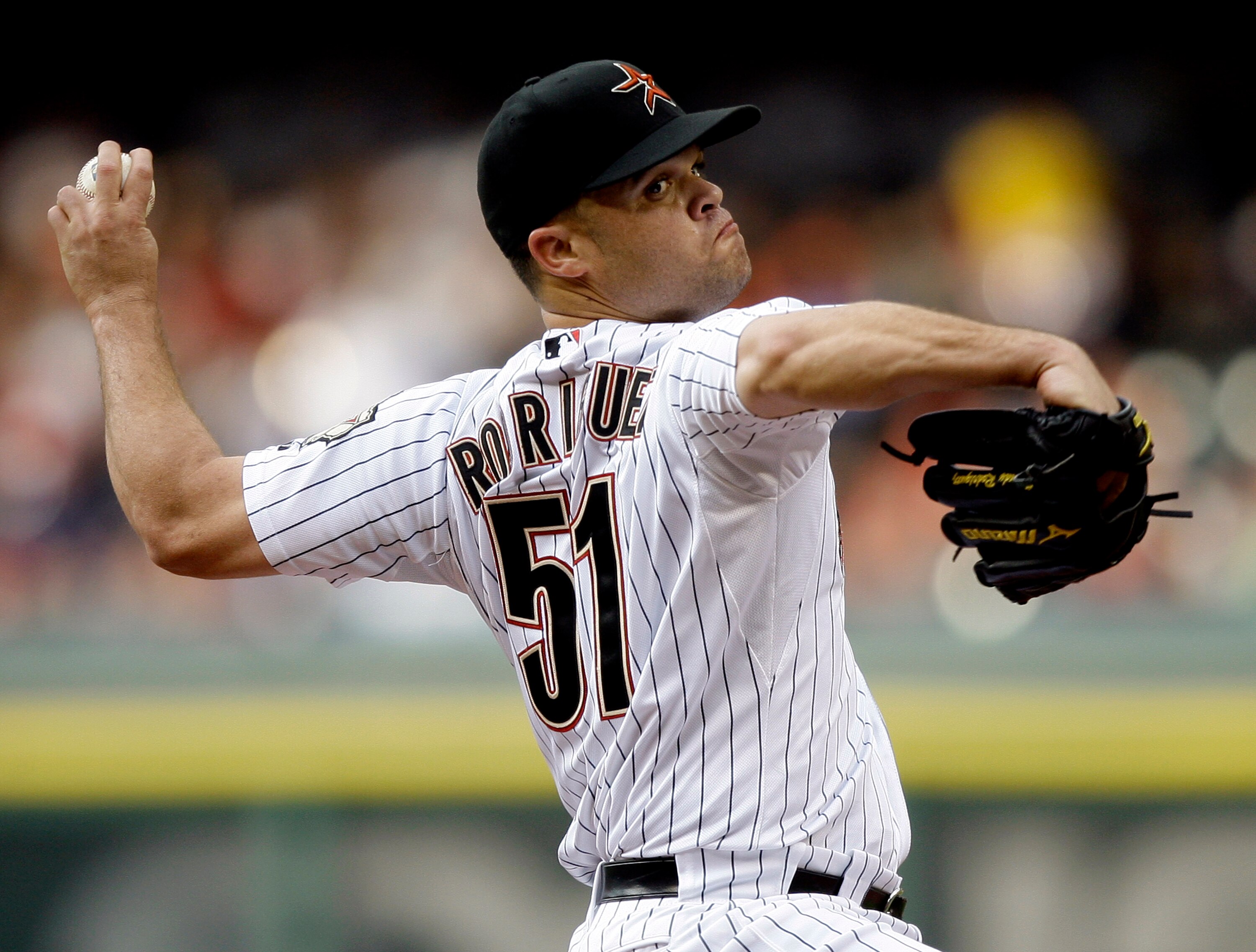 HOUSTON - APRIL 08:  Pitcher Wandy Rodriguez #51 of the Houston Astros throws against the Florida Marlins at Minute Maid Park on April 8, 2011 in Houston, Texas.  (Photo by Bob Levey/Getty Images)