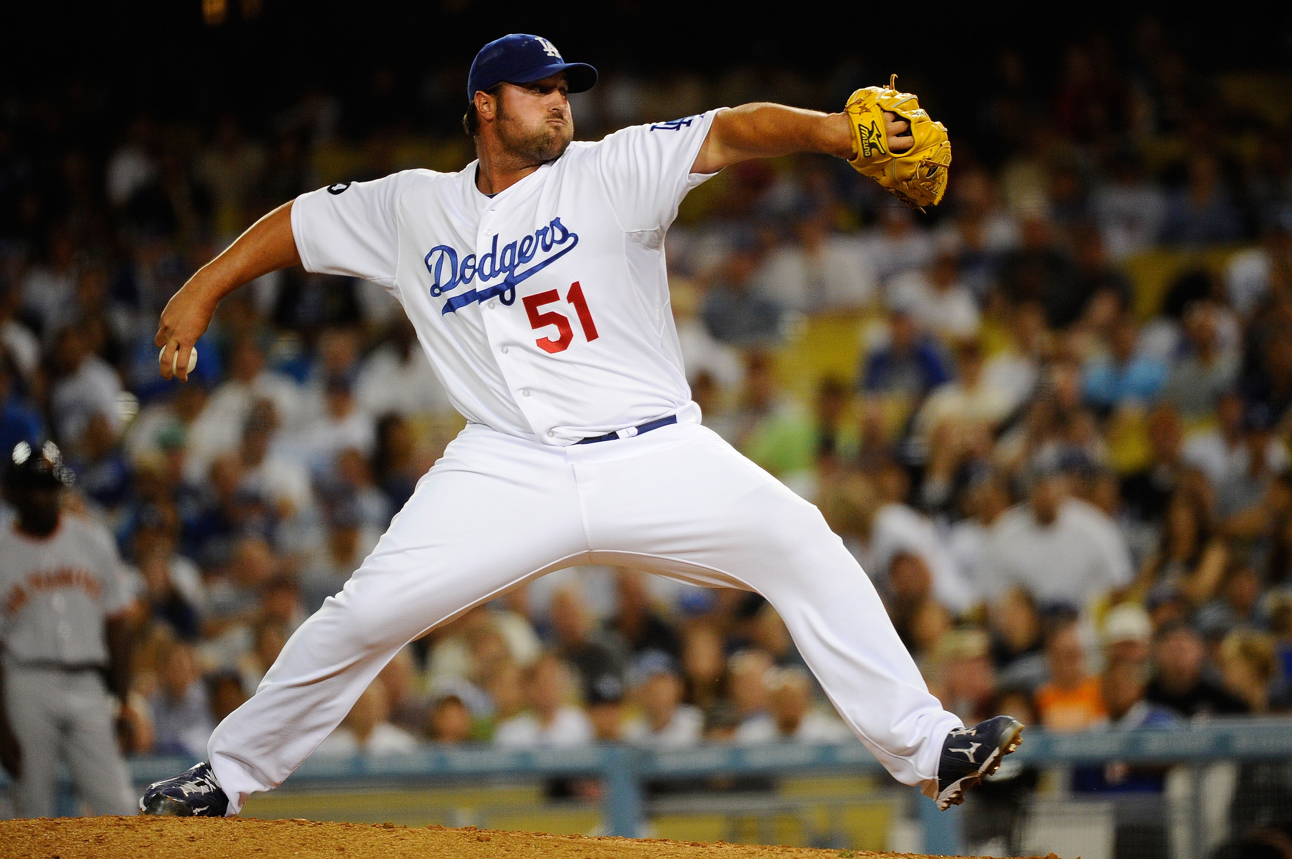 LOS ANGELES, CA - MARCH 31:  Jonathan Broxton #51 of the Los Angeles Dodgers throws a pitch in the ninth inning against the San Francisco Giants on Opening Day at Dodger Stadium on March 31, 2011 in Los Angeles, California.  (Photo by Kevork Djansezian/Ge