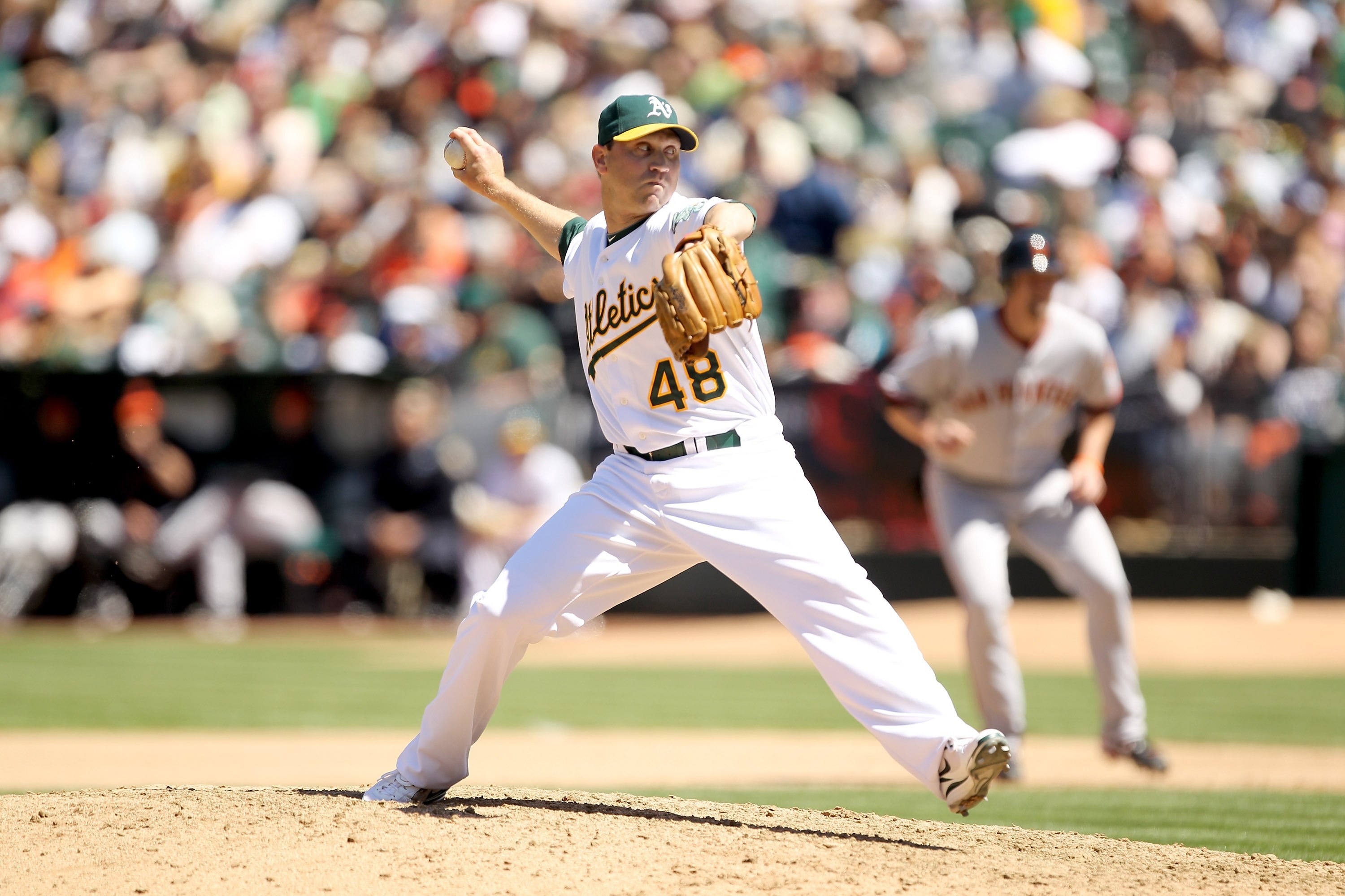 OAKLAND, CA - MAY 23:  Michael Wuertz #48 of the Oakland Athletics pitches against the San Francisco Giants at the Oakland-Alameda County Coliseum on May 23, 2010 in Oakland, California.  (Photo by Ezra Shaw/Getty Images)