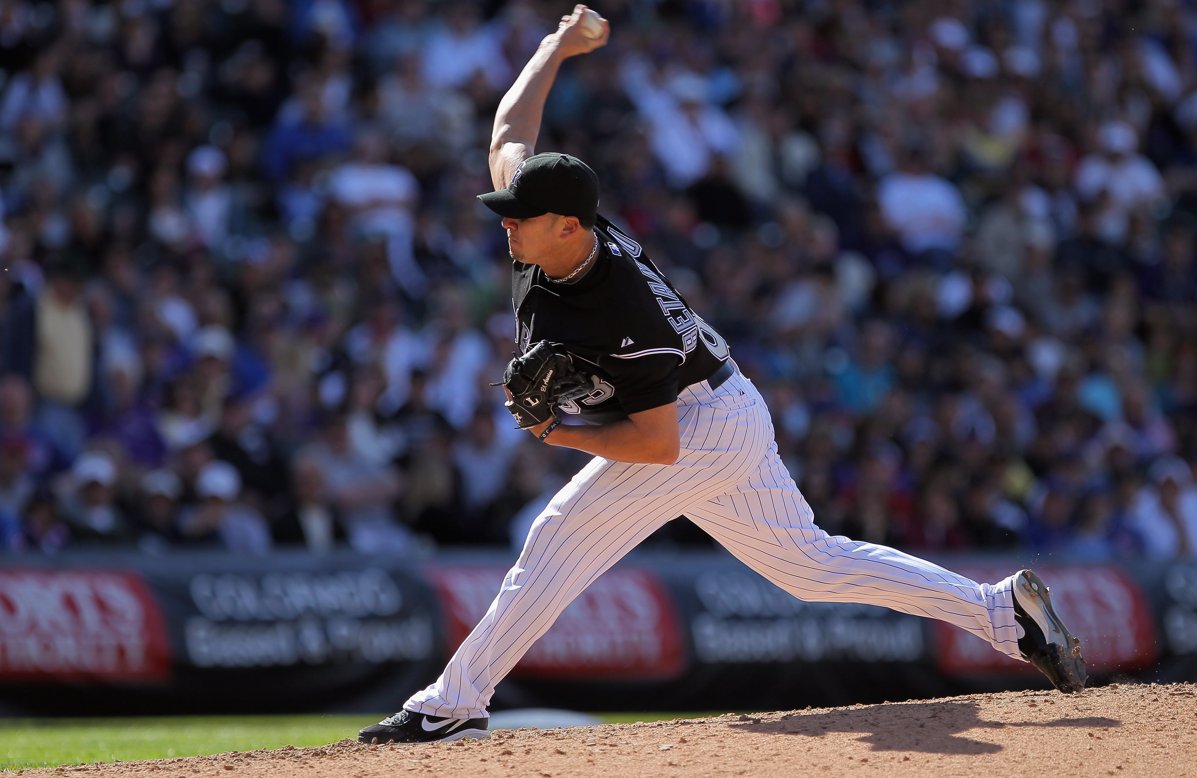 DENVER, CO - APRIL 17:  Pitcher Rafael Betancourt #63 of the Colorado Rockies works in relief against the Chicago Cubs at Coors Field on April 17, 2011 in Denver, Colorado. Betancourt pitched 2/3rds of the eighth inning and earned the win as the Rockies d