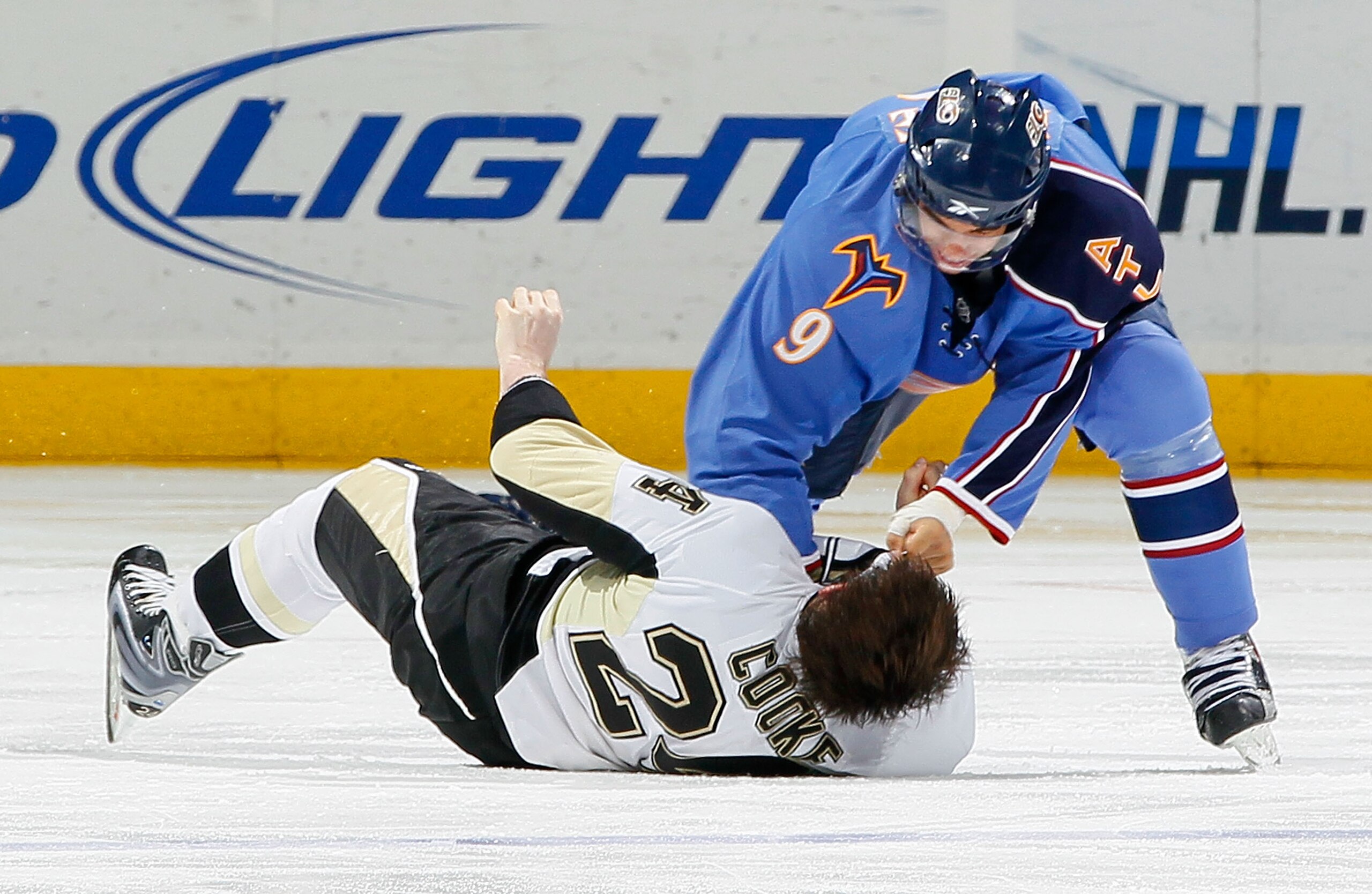 ATLANTA - APRIL 10:  Matt Cooke #24 of the Pittsburgh Penguins is knocked out by this right-handed punch from Evander Kane #9 of the Atlanta Thrashers at Philips Arena on April 10, 2010 in Atlanta, Georgia.  (Photo by Kevin C. Cox/Getty Images)