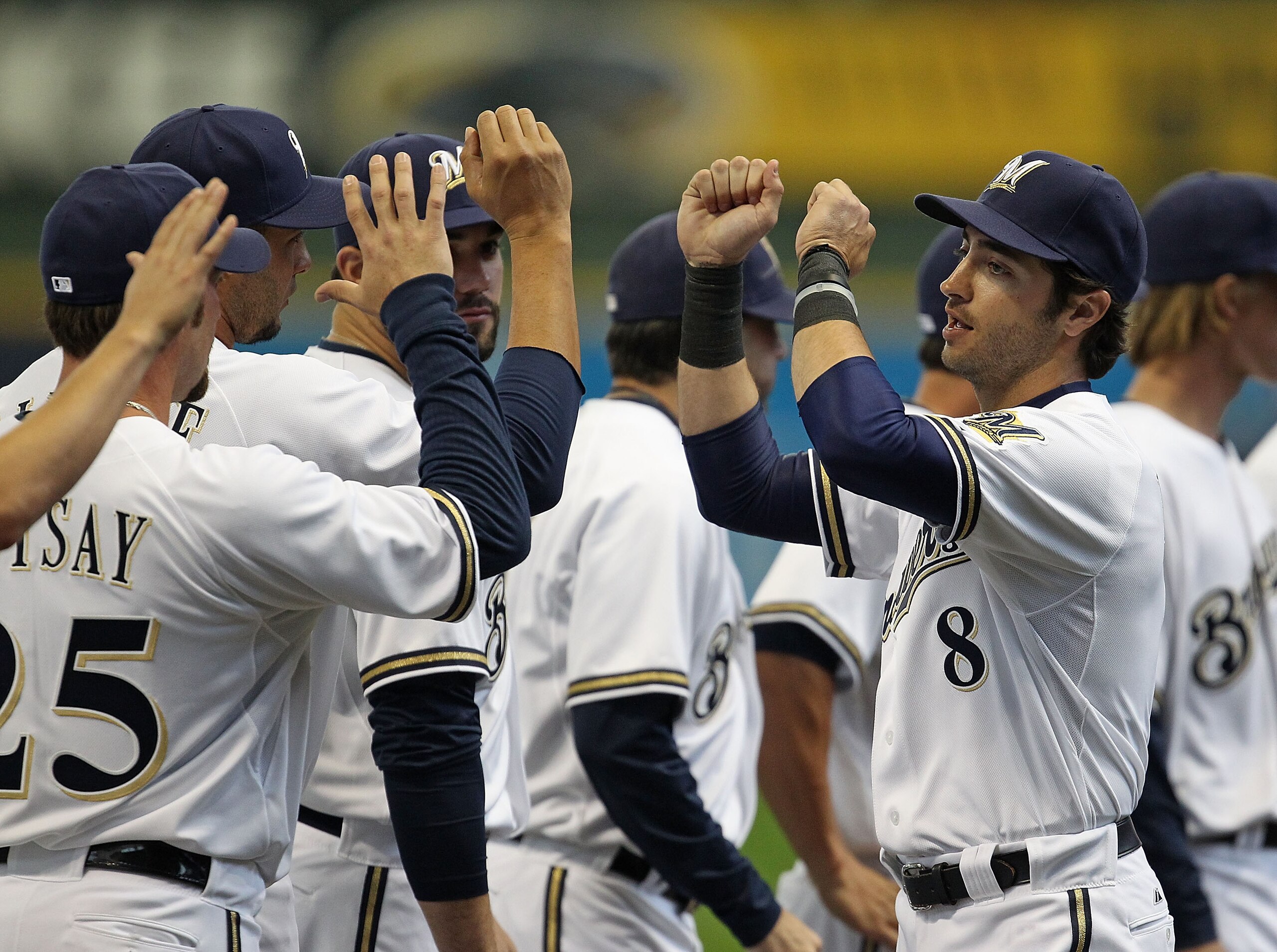 MILWAUKEE, WI - APRIL 04: Ryan Braun #8 of the Milwaukee Brewers greets teammates during player inrtoductions before the home opener against the Atlanta Braves at Miller Park on April 4, 2011 in Milwaukee, Wisconsin. The Braves defeated the Brewers 2-1. ( MILWAUKEE, WI - APRIL 04: Ryan Braun #8 of the Milwaukee Brewers greets teammates during player inrtoductions before the home opener against the Atlanta Braves at Miller Park on April 4, 2011 in Milwaukee, Wisconsin. The Braves defeated the Brewers 2-1. (