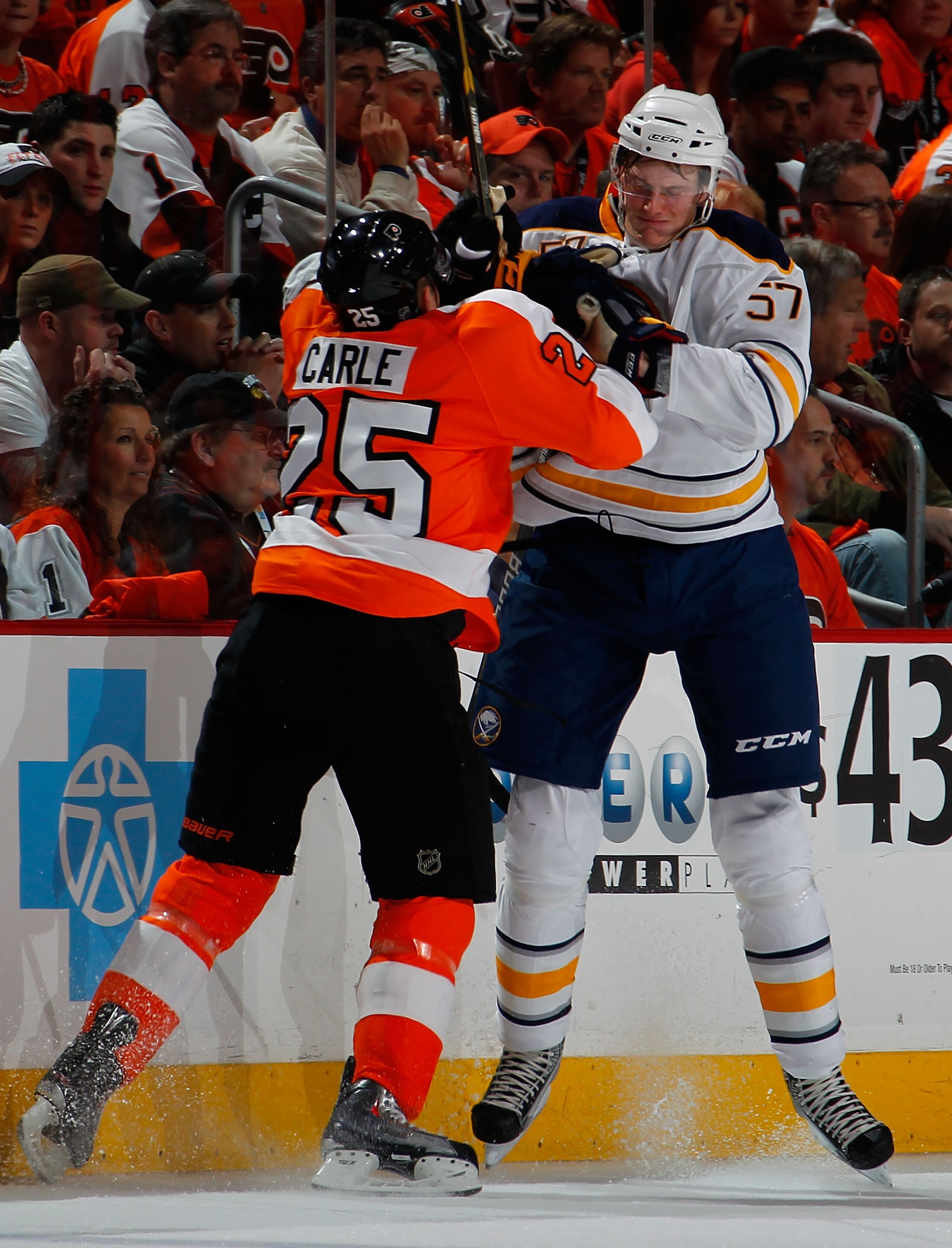 PHILADELPHIA, PA - APRIL 16:  Tyler Myers #57 of the Buffalo Sabres is checked by Matt Carle #25 of the Philadelphia Flyers during the first period of Game Two of the Eastern Conference Quarterfinals during the 2011 NHL Stanley Cup Playoffs at Wells Fargo