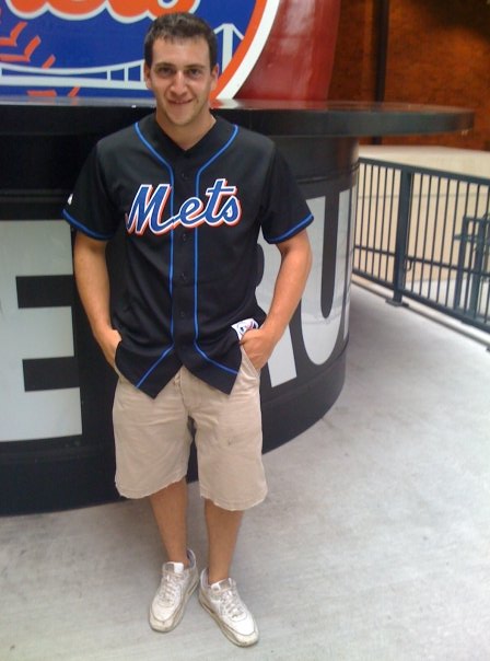 Mets fan and current Lehigh Valley Steelhawks kicker Paul Stoltz pays homage to the original Home Run Apple on display at CitiField.