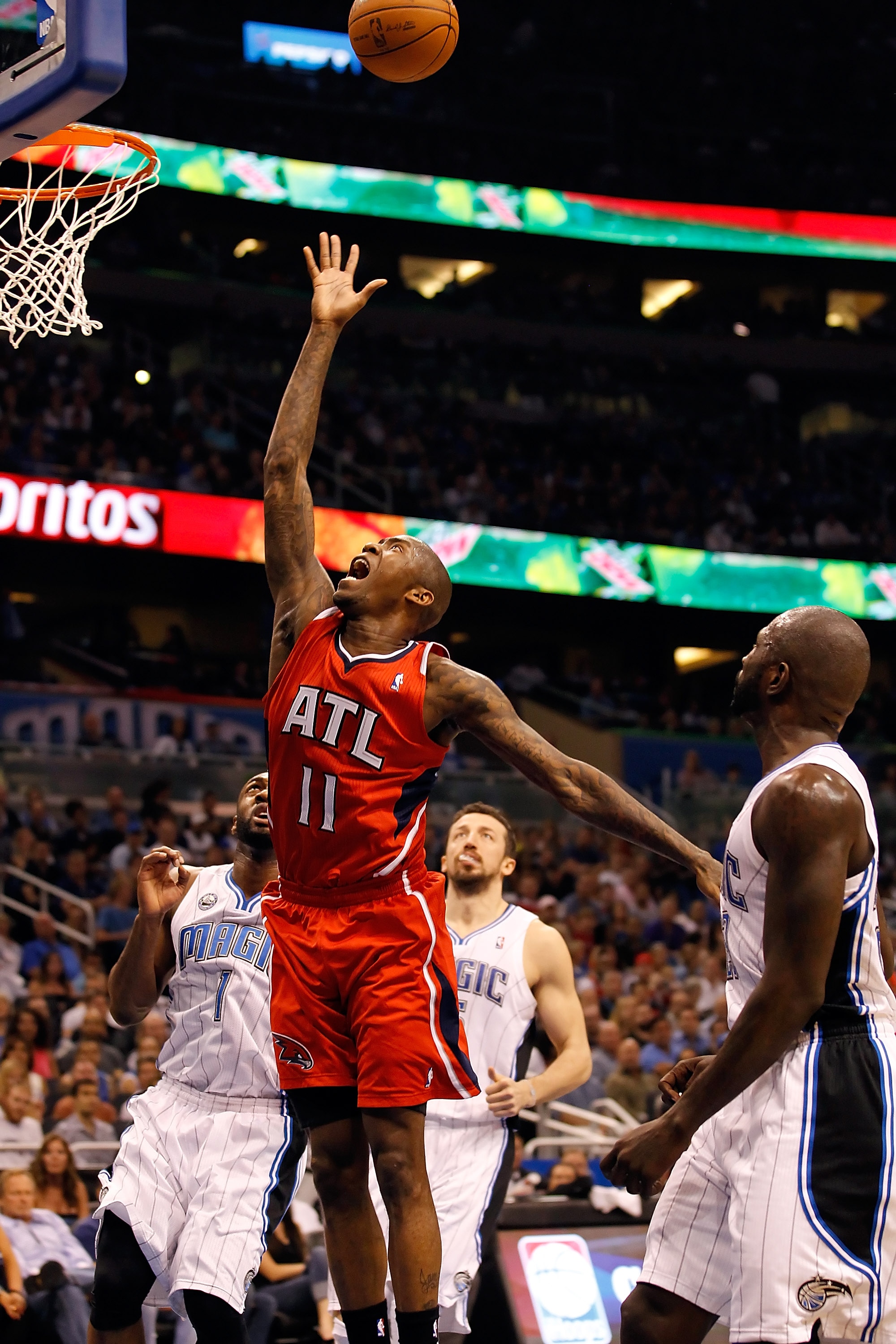 ORLANDO, FL - APRIL 16:  Jamal Crawford #11 of the Atlanta Hawks drives to the basket against the Orlando Magic during Game One of the Eastern Conference Quarterfinals of the 2011 NBA Playoffs on April 16, 2011 at the Amway Arena in Orlando, Florida.  NOT