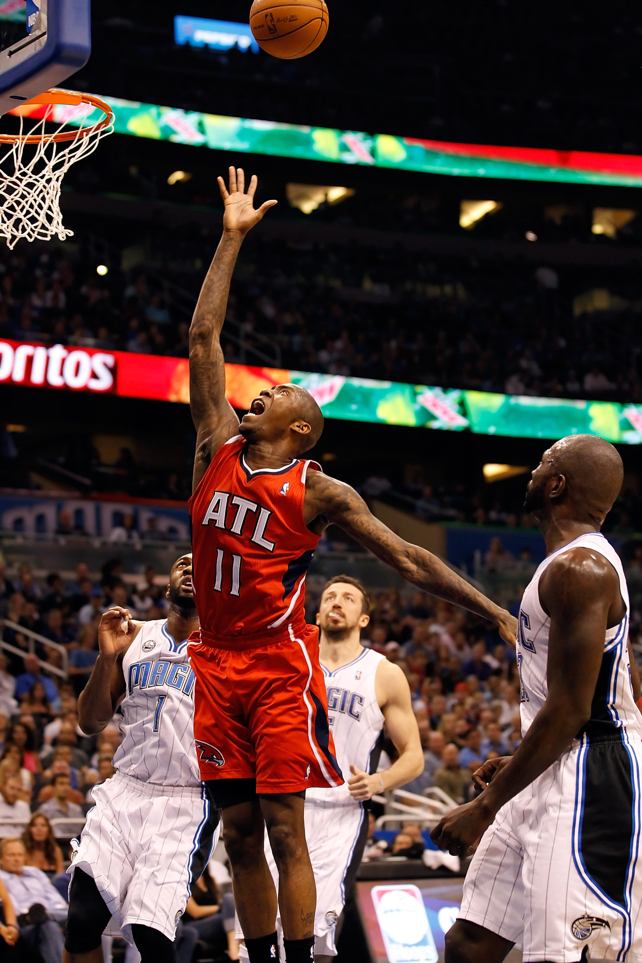 ORLANDO, FL - APRIL 16: Jamal Crawford #11 of the Atlanta Hawks drives to the basket against the Orlando Magic during Game One of the Eastern Conference Quarterfinals of the 2011 NBA Playoffs on April 16, 2011 at the Amway Arena in Orlando, Florida. NOT ORLANDO, FL - APRIL 16: Jamal Crawford #11 of the Atlanta Hawks drives to the basket against the Orlando Magic during Game One of the Eastern Conference Quarterfinals of the 2011 NBA Playoffs on April 16, 2011 at the Amway Arena in Orlando, Florida. NOT