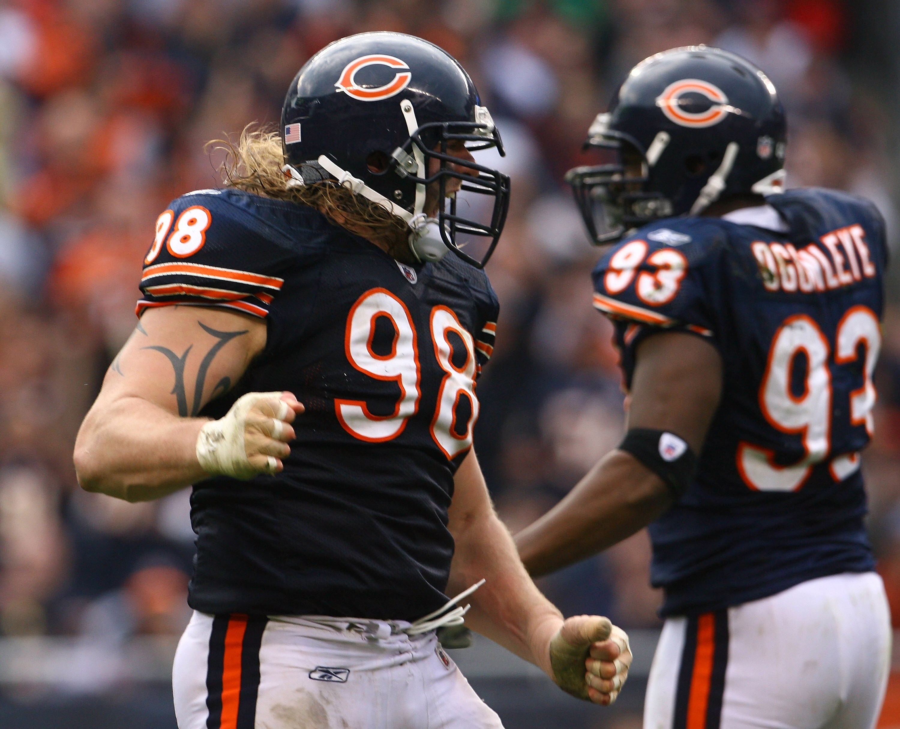 CHICAGO - NOVEMBER 02:  Dusty Dvoracek #98 of the Chicago Bears celebrates after making a tackle against the Detroit Lions during the game at Soldier Field on November 2, 2008 in Chicago, Illinois. The Bears defeated the Lions 27-23.  (Photo by Jeff Gross