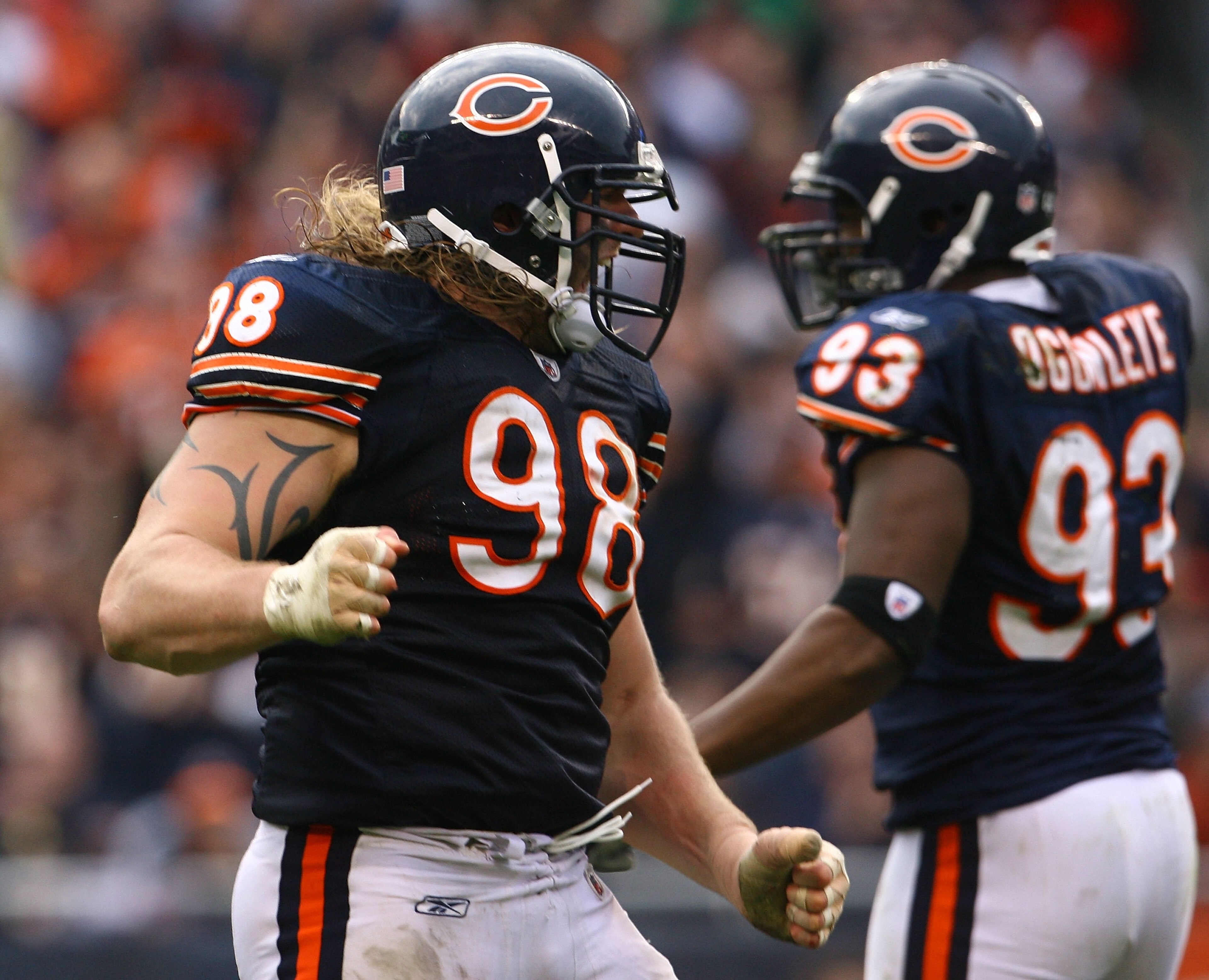 CHICAGO - NOVEMBER 02:  Dusty Dvoracek #98 of the Chicago Bears celebrates after making a tackle against the Detroit Lions during the game at Soldier Field on November 2, 2008 in Chicago, Illinois. The Bears defeated the Lions 27-23.  (Photo by Jeff Gross
