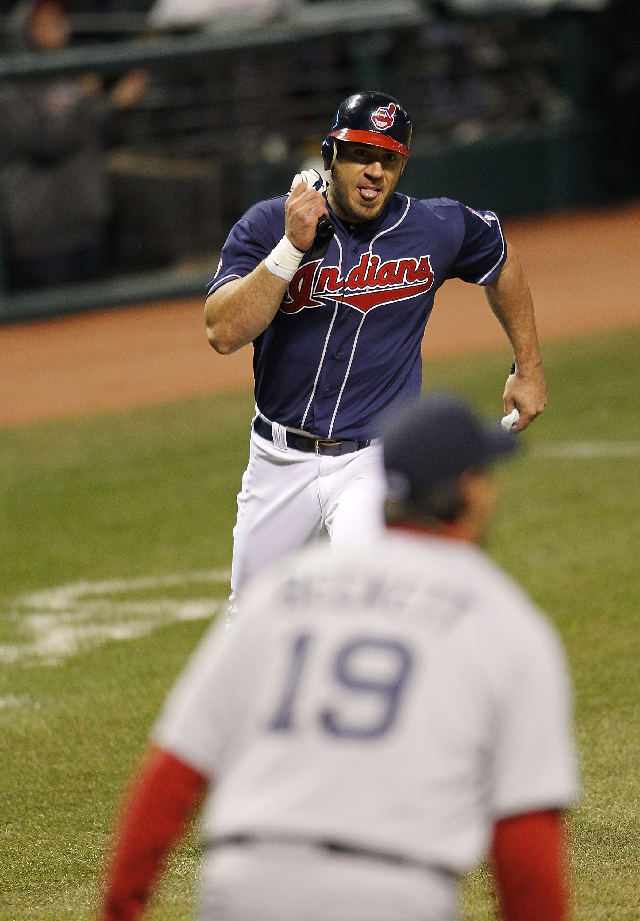 CLEVELAND - APRIL 05: Travis Hafner #48 of the Cleveland Indians scores in the fourth inning on a single by Orlando Cabrera #20 of the Cleveland Indians during the game against the Boston Red Sox at Progressive Field on April 5, 2011 in Cleveland, Ohio.