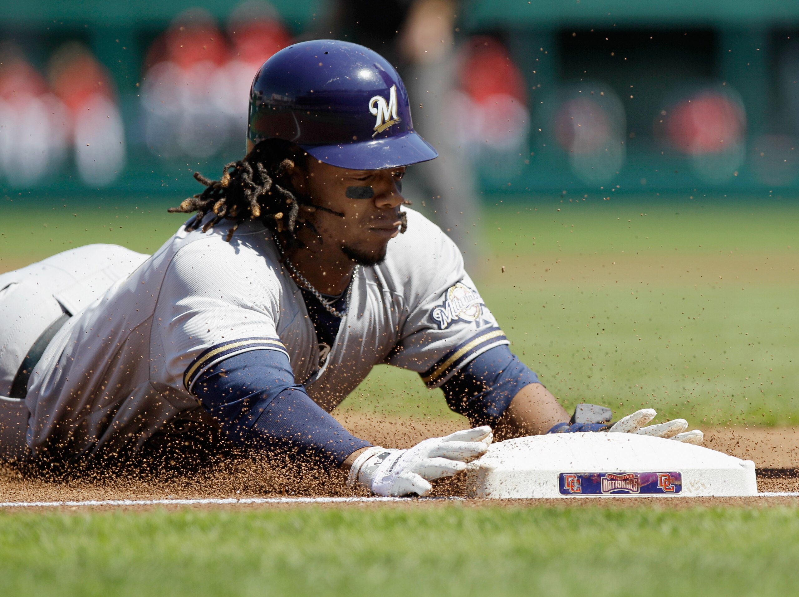 WASHINGTON, DC - APRIL 17:  Rickie Weeks #23 of the Milwaukee Brewers slides safely into third base during the first inning against the Washington Nationals during game one of a doubleheader at Nationals Park on April 17, 2011 in Washington, DC.  (Photo b