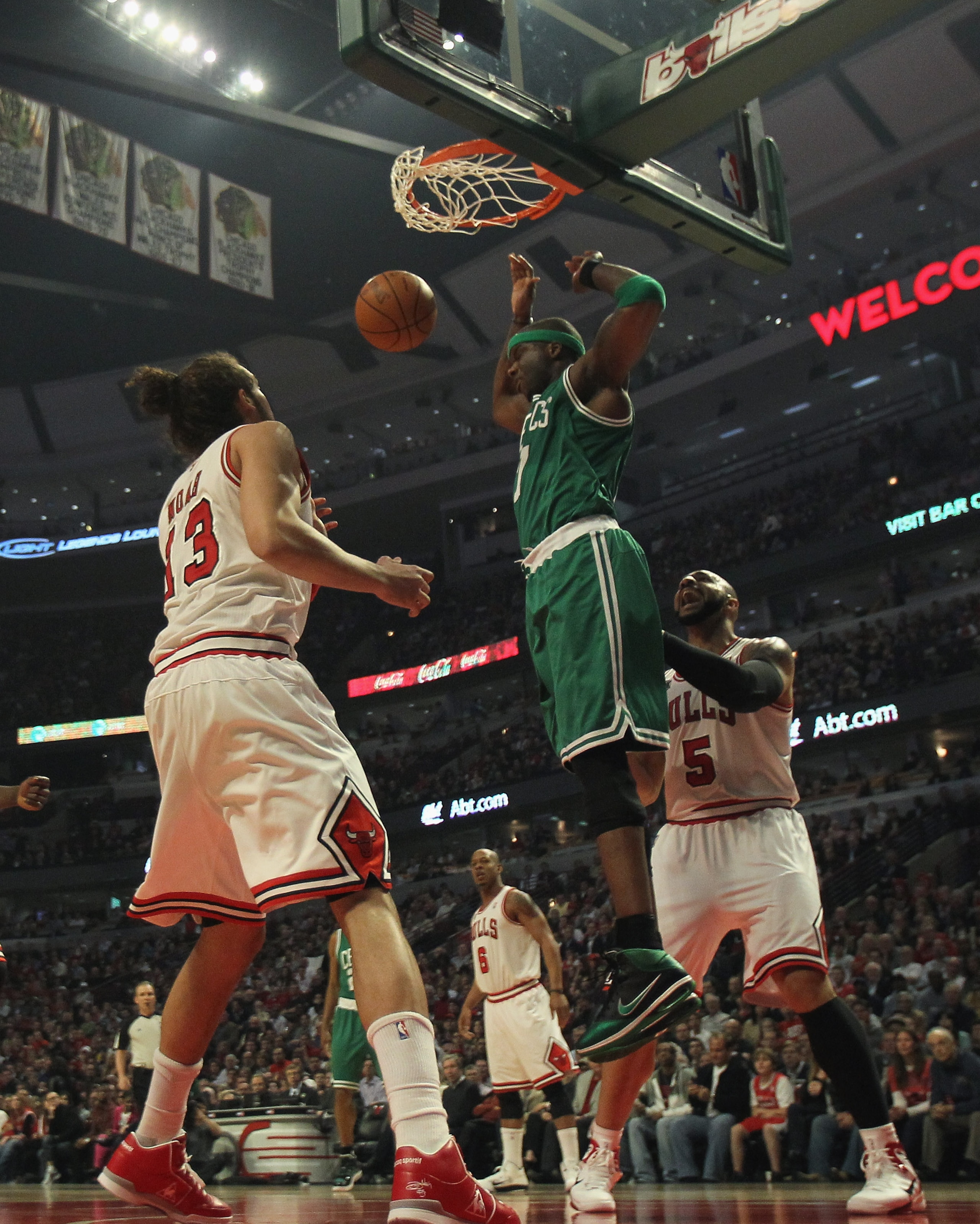CHICAGO, IL - APRIL 07: Jermaine O'Neal #7 of the Boston Celtics dunks the ball between Joakim Noah #13 and Carlos Boozer #5 of the Chicago Bulls at United Center on April 7, 2011 in Chicago, Illinois. The Bulls defeated the Celtics 97-81. NOTE TO USER: U CHICAGO, IL - APRIL 07: Jermaine O'Neal #7 of the Boston Celtics dunks the ball between Joakim Noah #13 and Carlos Boozer #5 of the Chicago Bulls at United Center on April 7, 2011 in Chicago, Illinois. The Bulls defeated the Celtics 97-81. NOTE TO USER: U