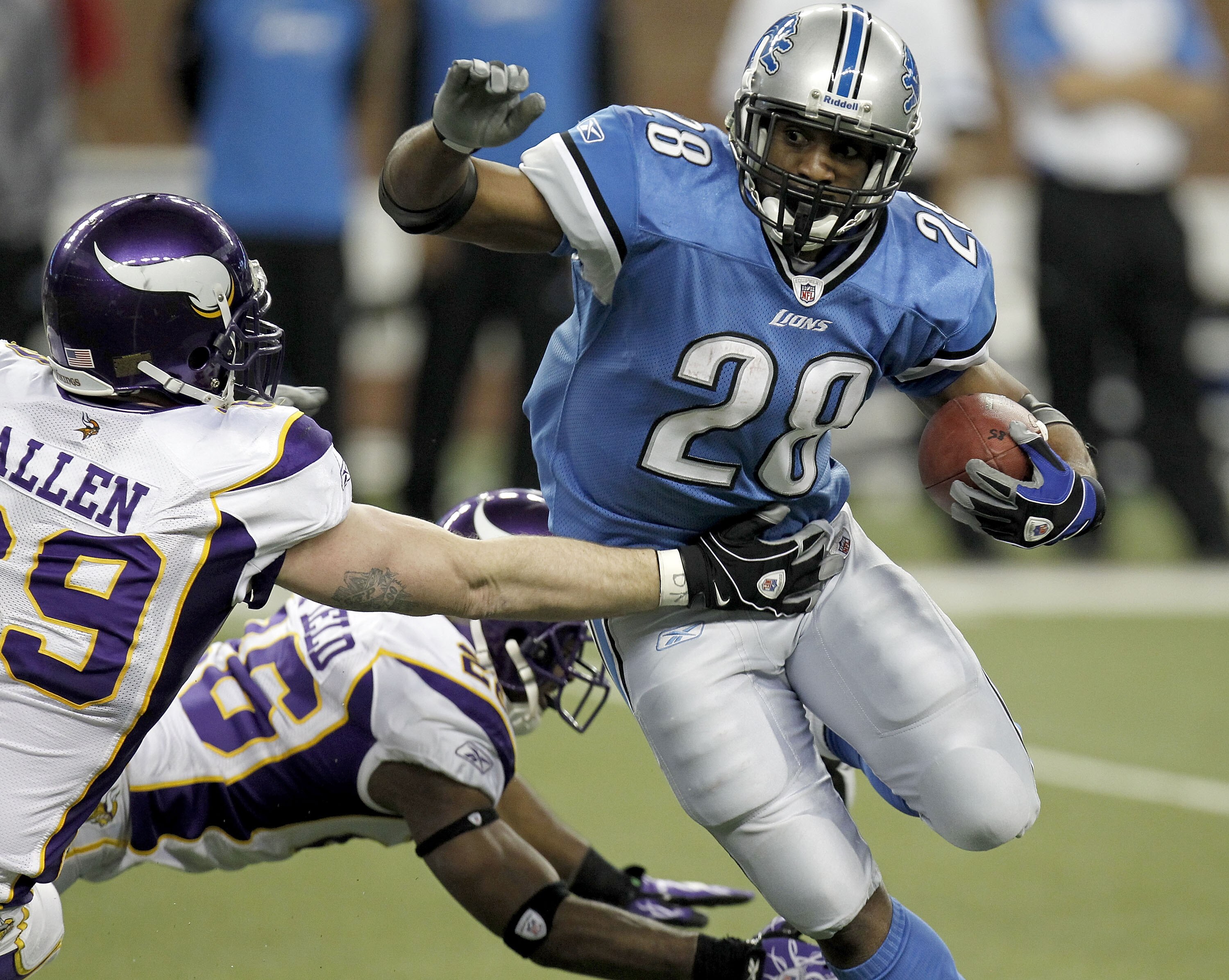 DETROIT, MI - JANUARY 02: Maurice Morris #28 of the Detroit Lions tries to get around the tackle of Jared Allen #69 of the Minnesota Vikings at Ford Field on January 2, 2011 in Detroit, Michigan. Detroit won the game 20-13.  (Photo by Gregory Shamus/Getty