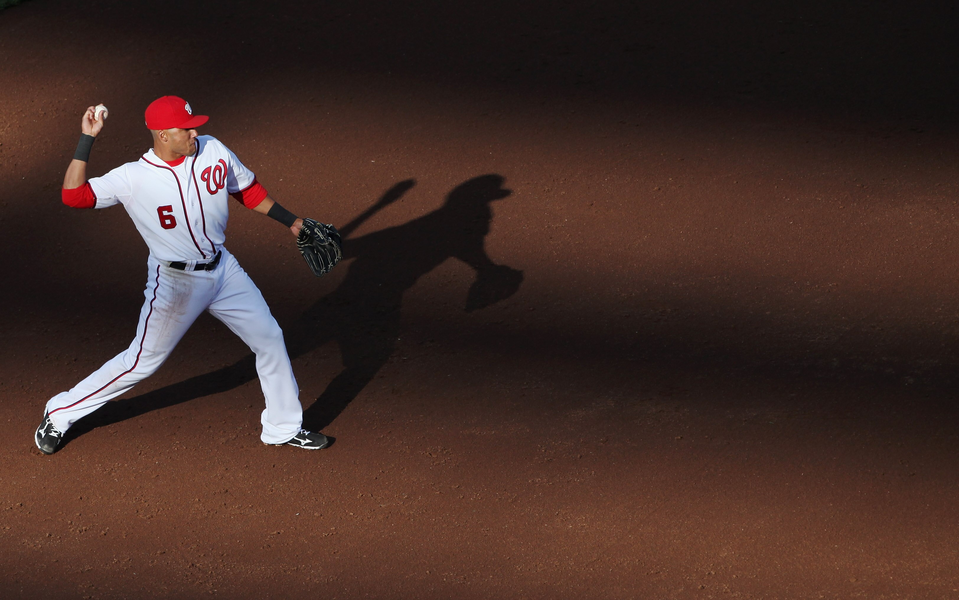 WASHINGTON, DC - APRIL 17:  Shortstop Ian Desmond #6 of the Washington Nationals throws the ball to first base against the Milwaukee Brewers during the third inning of the second game of a doubleheader at Nationals Park on April 17, 2011 in Washington, DC