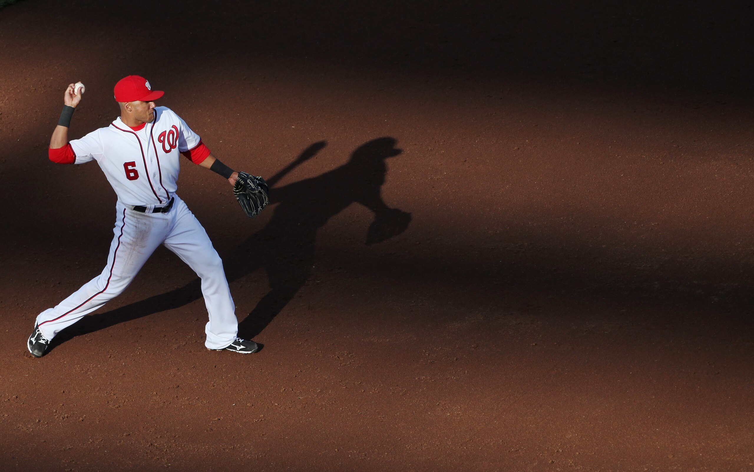 WASHINGTON, DC - APRIL 17:  Shortstop Ian Desmond #6 of the Washington Nationals throws the ball to first base against the Milwaukee Brewers during the third inning of the second game of a doubleheader at Nationals Park on April 17, 2011 in Washington, DC