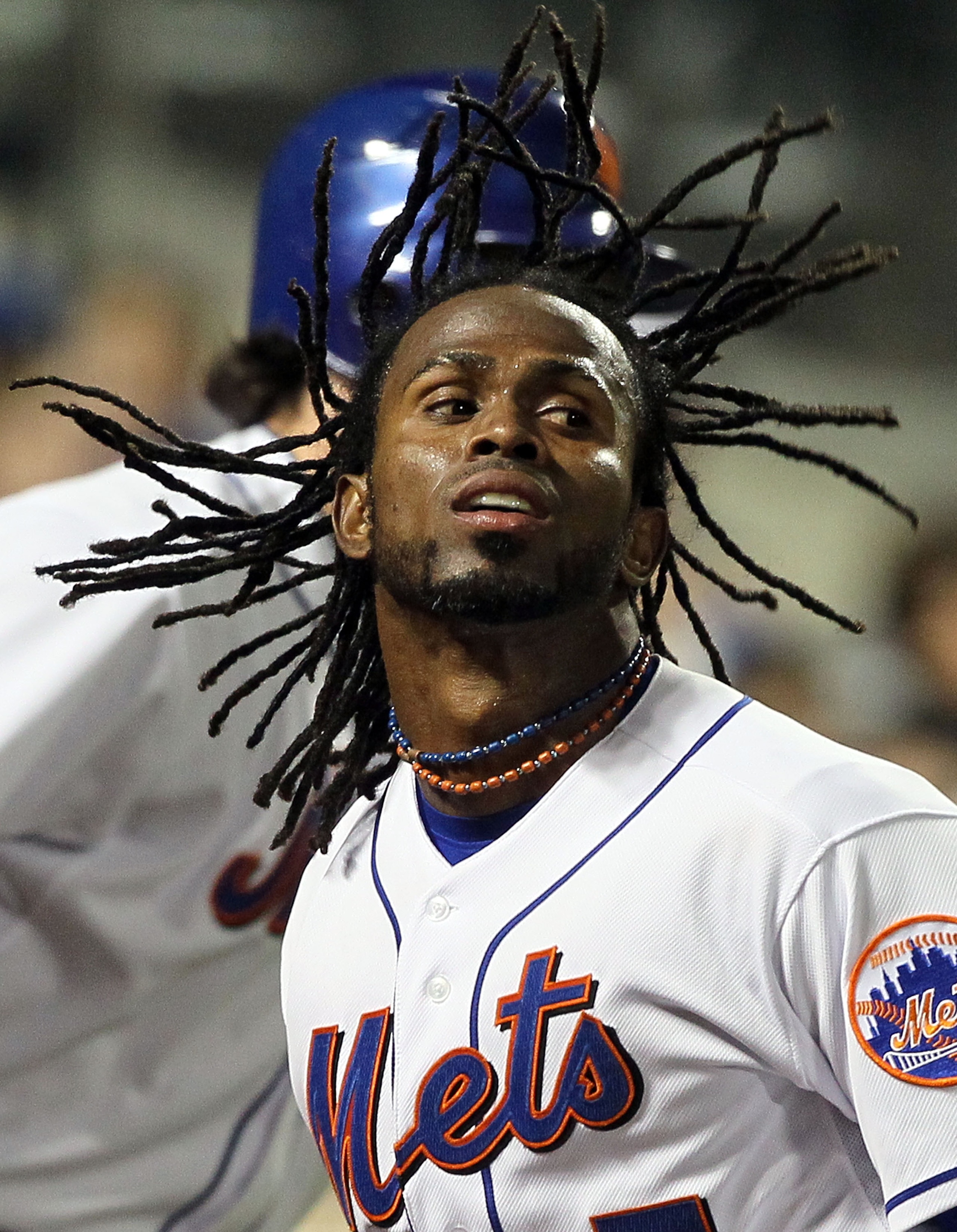 NEW YORK, NY - APRIL 11:  Jose Reyes #7 of the New York Mets celebrates after scoring a run in the third inning against the Colorado Rockies on April 11, 2011 at Citi Field in the Flushing neighborhood of the Queens borough of New York City.  (Photo by Ji