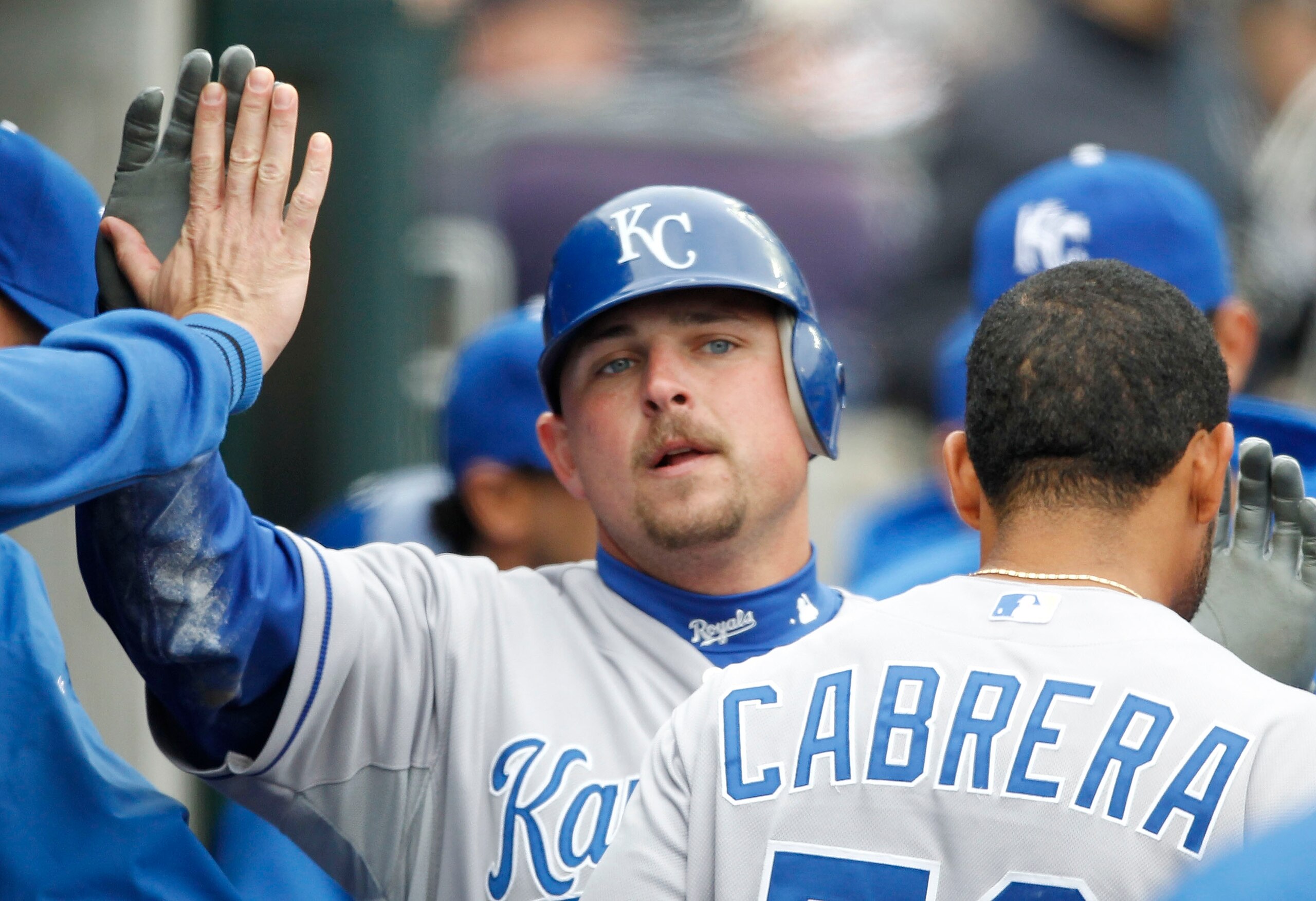 DETROIT - APRIL 09: Billy Butler #16 of the Kansas City Royals is congratulated by his teammates after scoring in the second inning during the game against the Detroit Tigers at Comerica Park on April 9, 2011 in Detroit, Michigan.  (Photo by Leon Halip/Ge