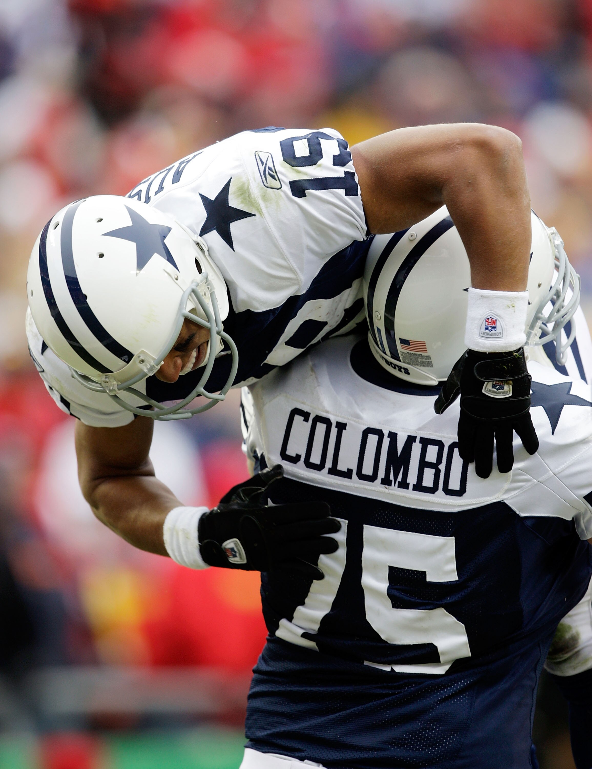 KANSAS CITY, MO - OCTOBER 11:  Miles Austin #19 of the Dallas Cowboys celebrates a touchdown as he is lifted up by Marc Columbo #75 during the game against the Kansas City Chiefs on October 11, 2009 at Arrowhead Stadiumin Kansas City, Missouri.  (Photo by