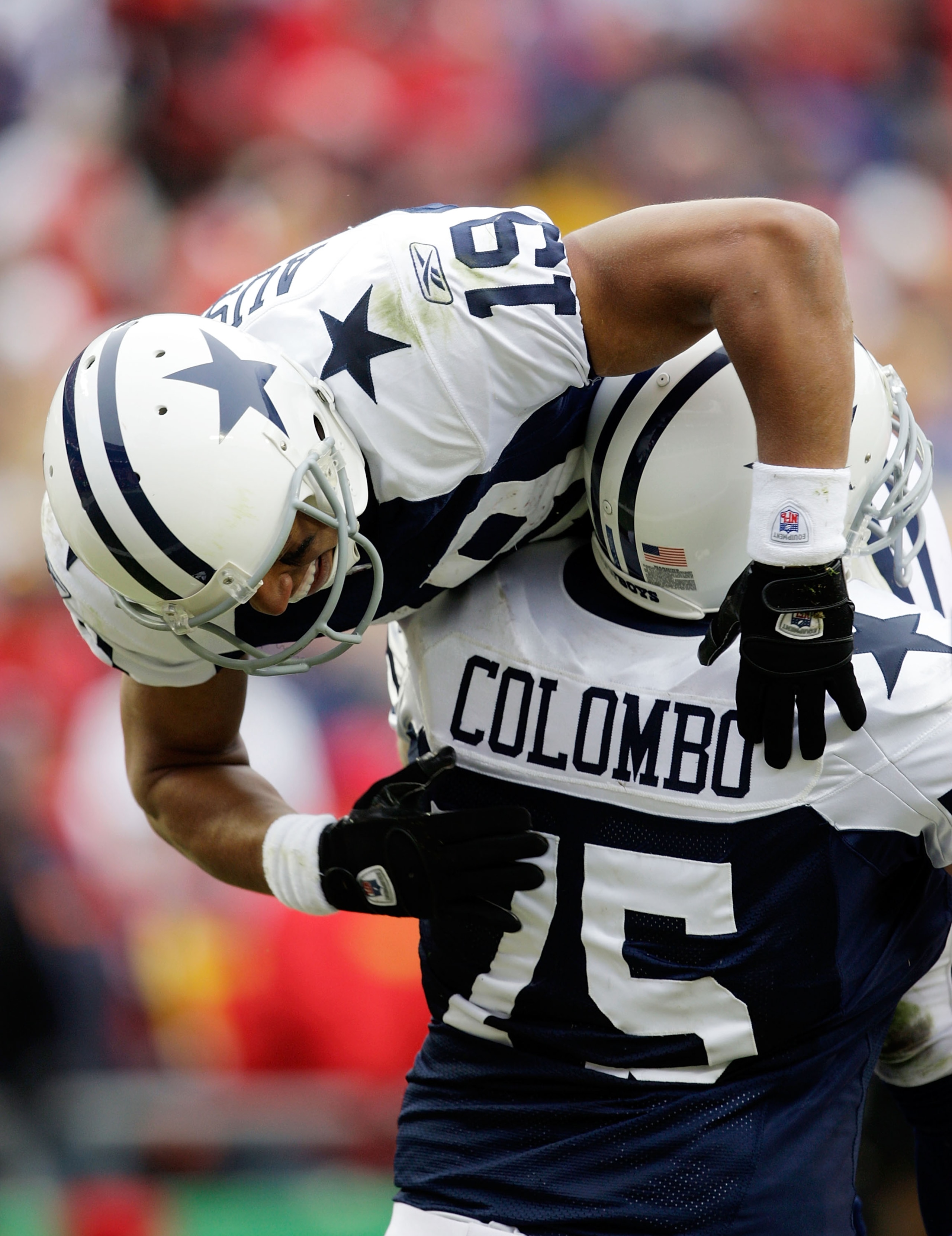 KANSAS CITY, MO - OCTOBER 11:  Miles Austin #19 of the Dallas Cowboys celebrates a touchdown as he is lifted up by Marc Columbo #75 during the game against the Kansas City Chiefs on October 11, 2009 at Arrowhead Stadiumin Kansas City, Missouri.  (Photo by