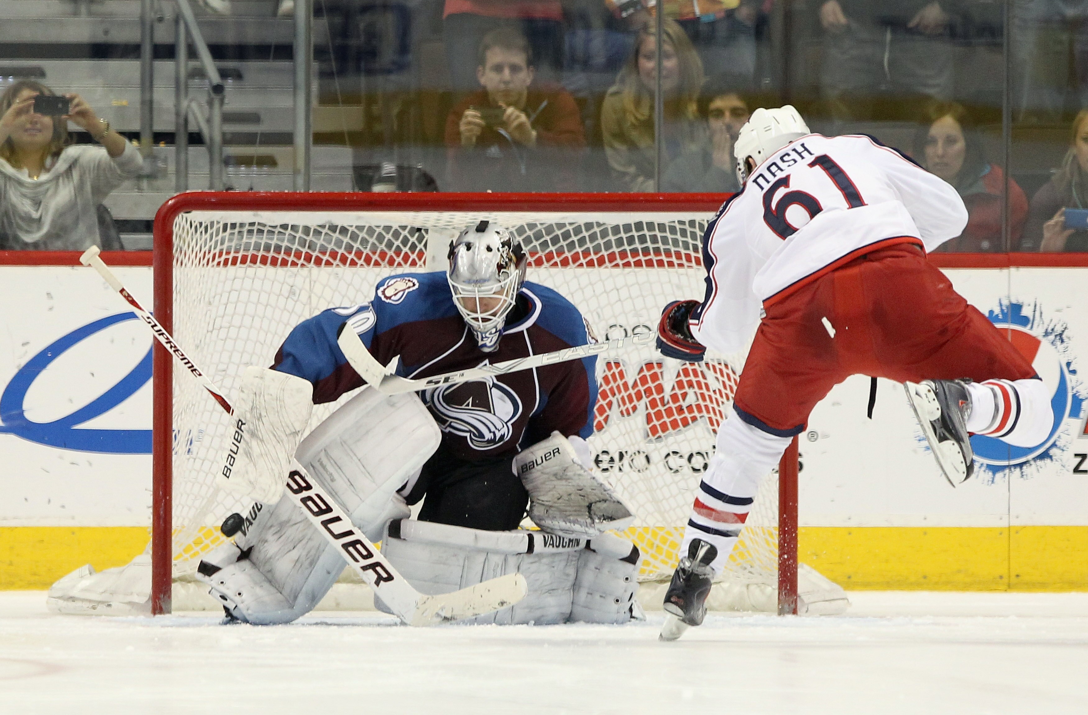 DENVER, CO - MARCH 22:  Goalie Brian Elliott #30 of the Colorado Avalanche makes a save on a shot by Rick Nash #61 of the Columbus Blue Jackets during their overtime shootout at the Pepsi Center on March 22, 2011 in Denver, Colorado. The Avalanche defeate