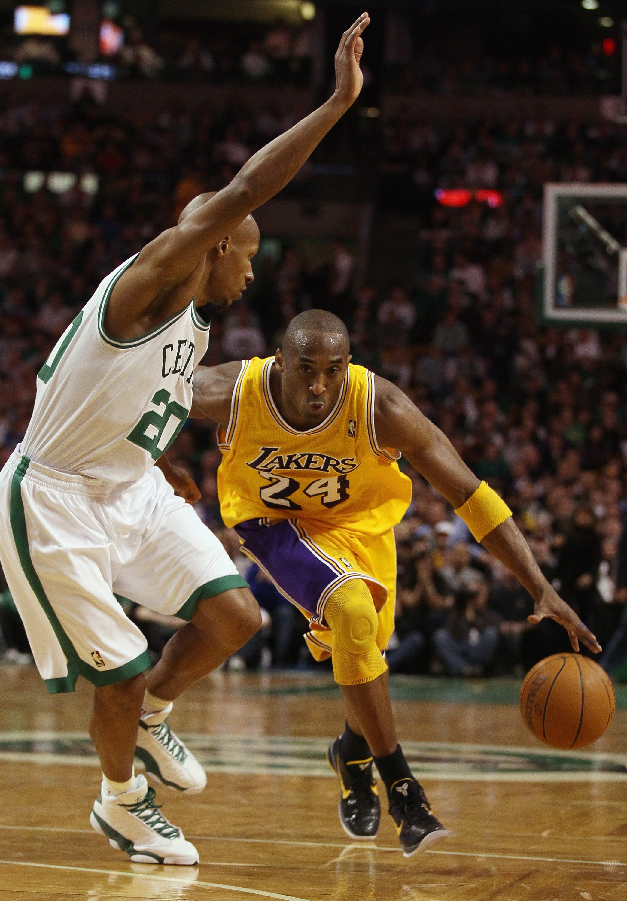 BOSTON, MA - FEBRUARY 10:  Kobe Bryant #24 of the Los Angeles Lakers drives around Ray Allen #20 of the Boston Celtics on February 10, 2011 at the TD Garden in Boston, Massachusetts.  The Lakers defeated the Celtics 92-86. NOTE TO USER: User expressly ack