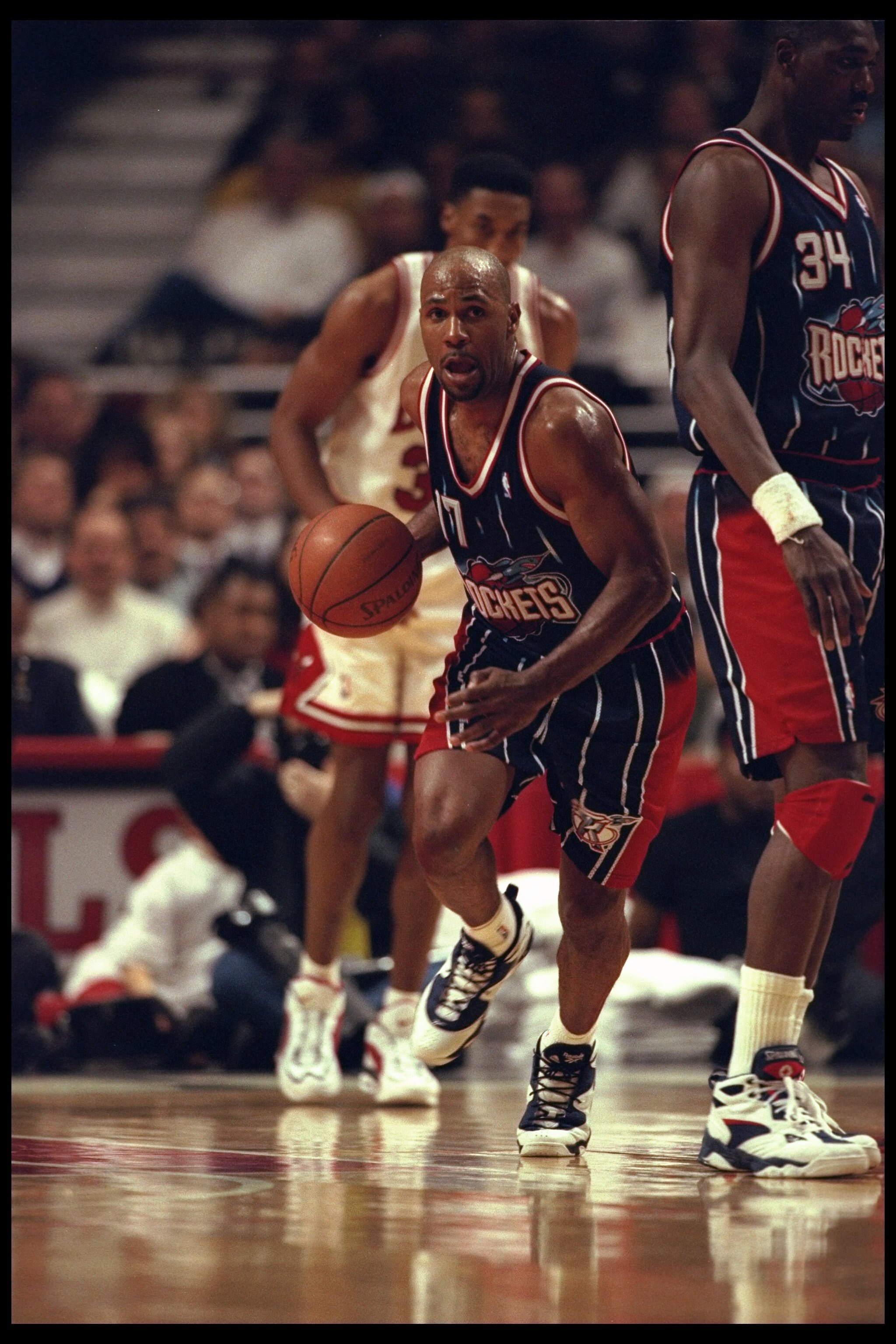 3 Jan 1996:  Forward Mario Elie of the Houston Rockets moves the ball against the Chicago Bulls during a game played at the United Arena in Chicago, Illinois.  The Bulls won the game, 100-86. Mandatory Credit: Jonathan Daniel/Allsport