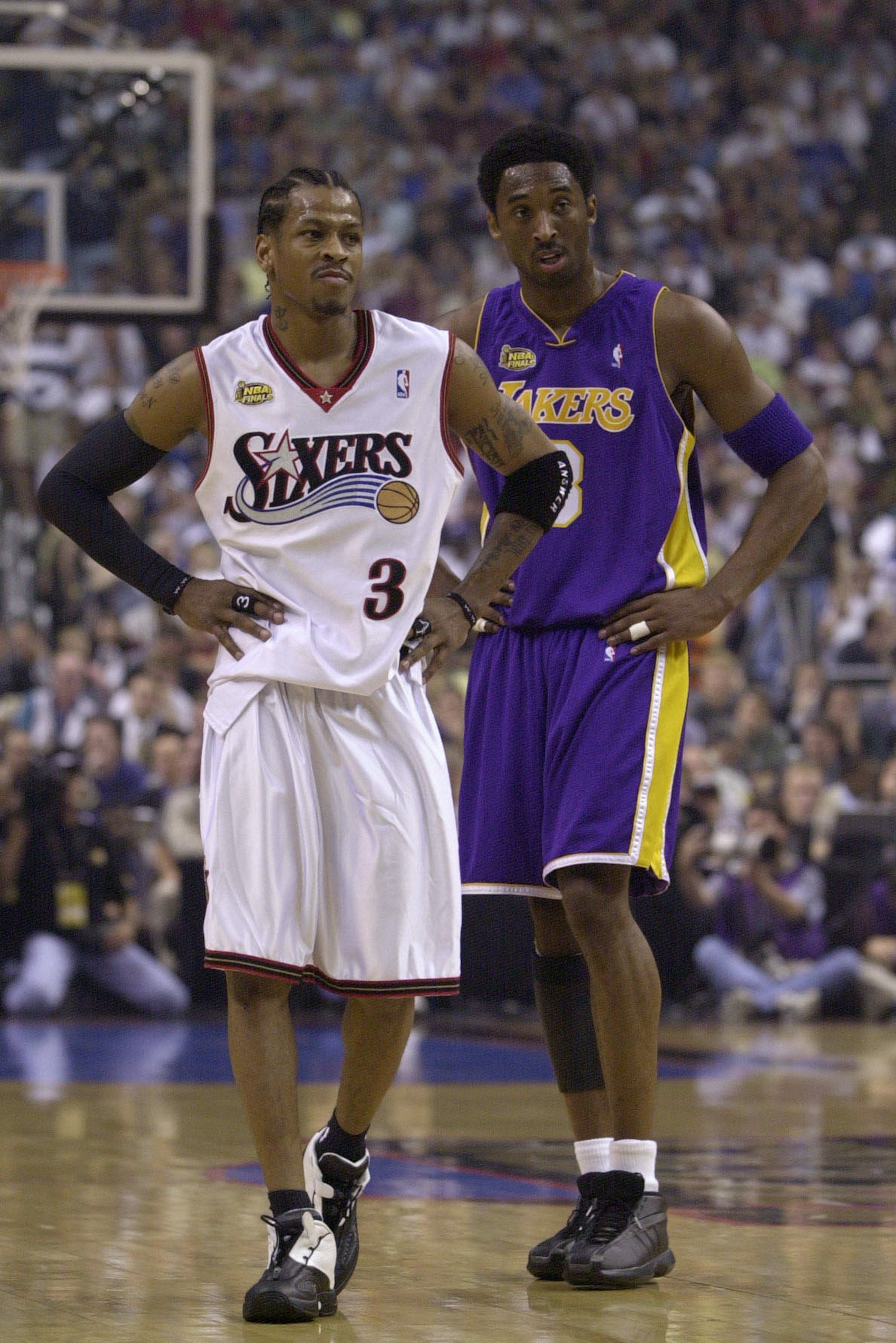 10 Jun 2001:  Allen Iverson #3 of the Philadelphia 76ers stands with Kobe Bryant #8 of the Los Angeles Lakers during game 3 of the NBA Finals at the First Union Center in Philadelphia, Pennsylvania.  DIGITAL IMAGE Mandatory Credit: Ezra Shaw/ALLSPORT. NOT