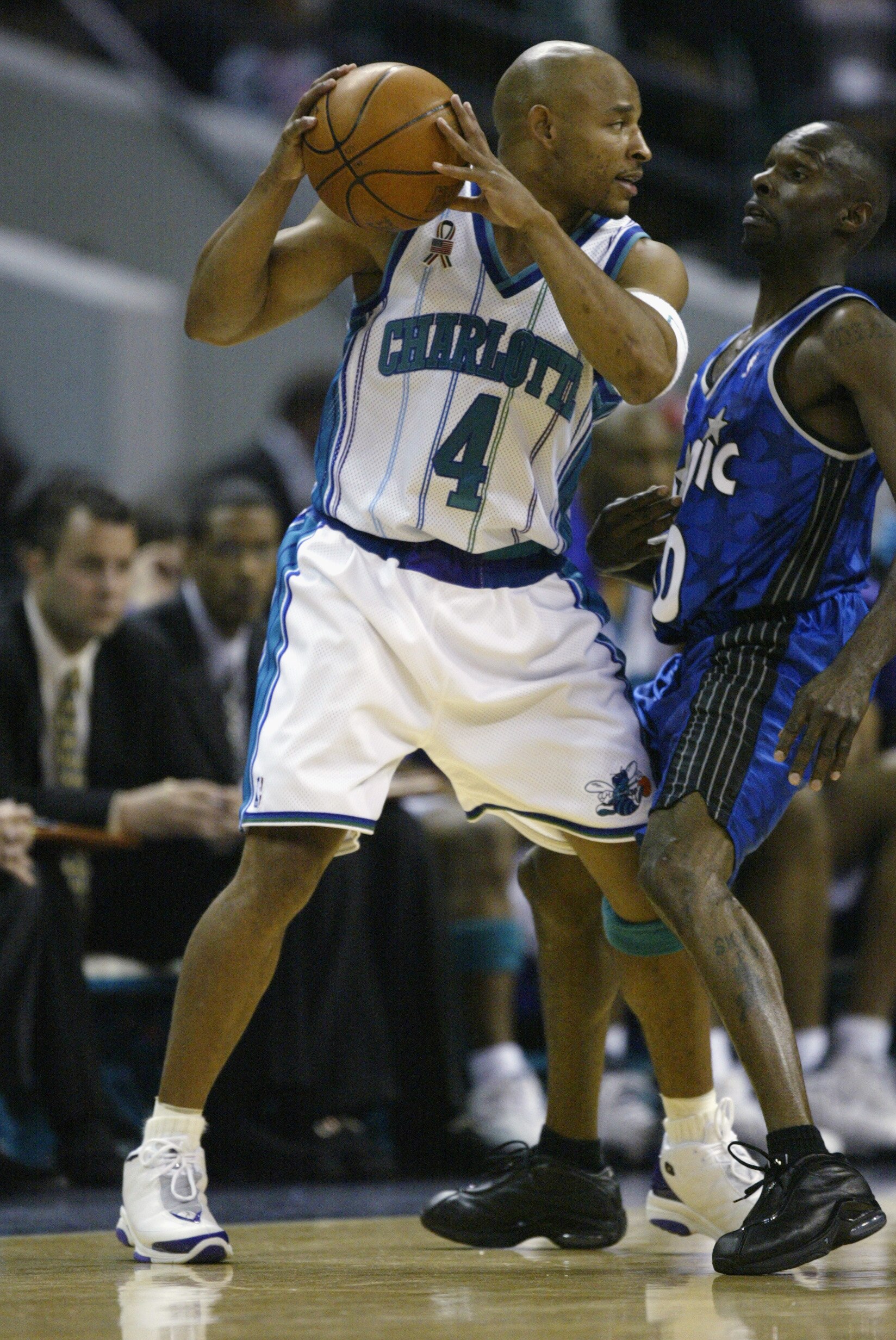 CHARLOTTE - APRIL 23:  Guard David Wesley #4 of the Charlotte Hornets faces up point guard Darrell Armstrong #10 of the Orlando Magic during game two of the Eastern Conference Quarterfinals during the 2002 NBA Playoffs at Charlotte Colesium in Charlotte,
