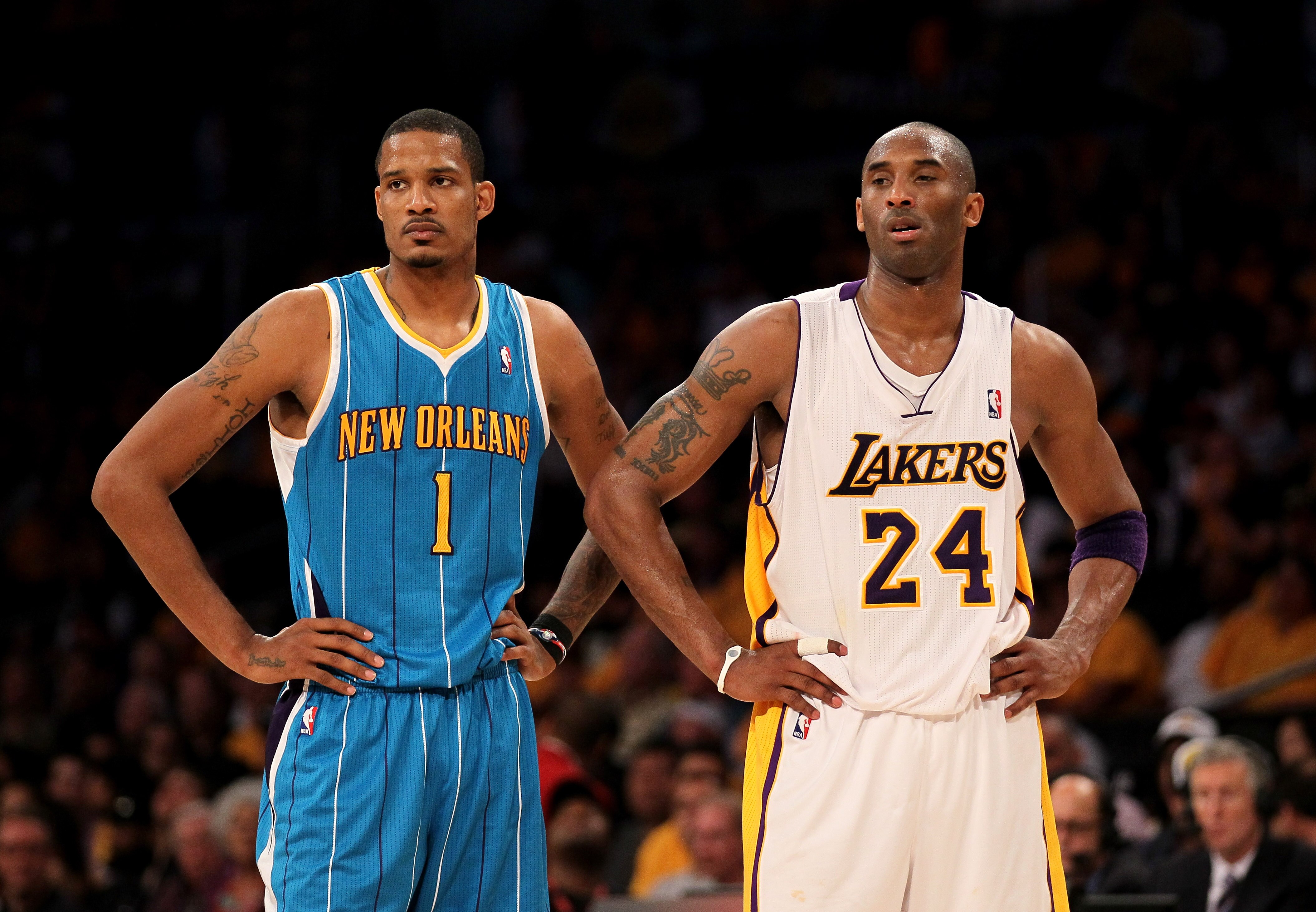 LOS ANGELES, CA - APRIL 17:  Trevor Ariza #1 of  the New Orleans Hornets and Kobe Bryant #24 of the Los Angeles Lakers stand during a break in Game One of the Western Conference Quarterfinals in the 2011 NBA Playoffs on April 17, 2011 at Staples Center in